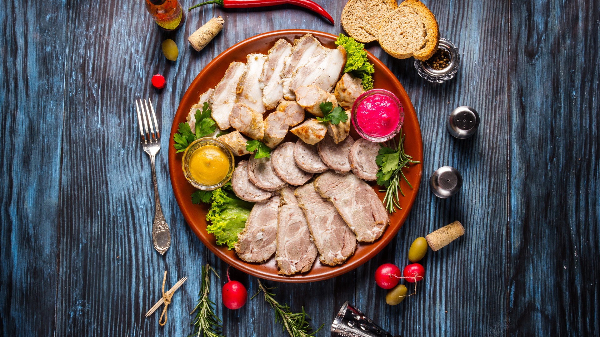 Meat platter in a plate with sauce and herbs