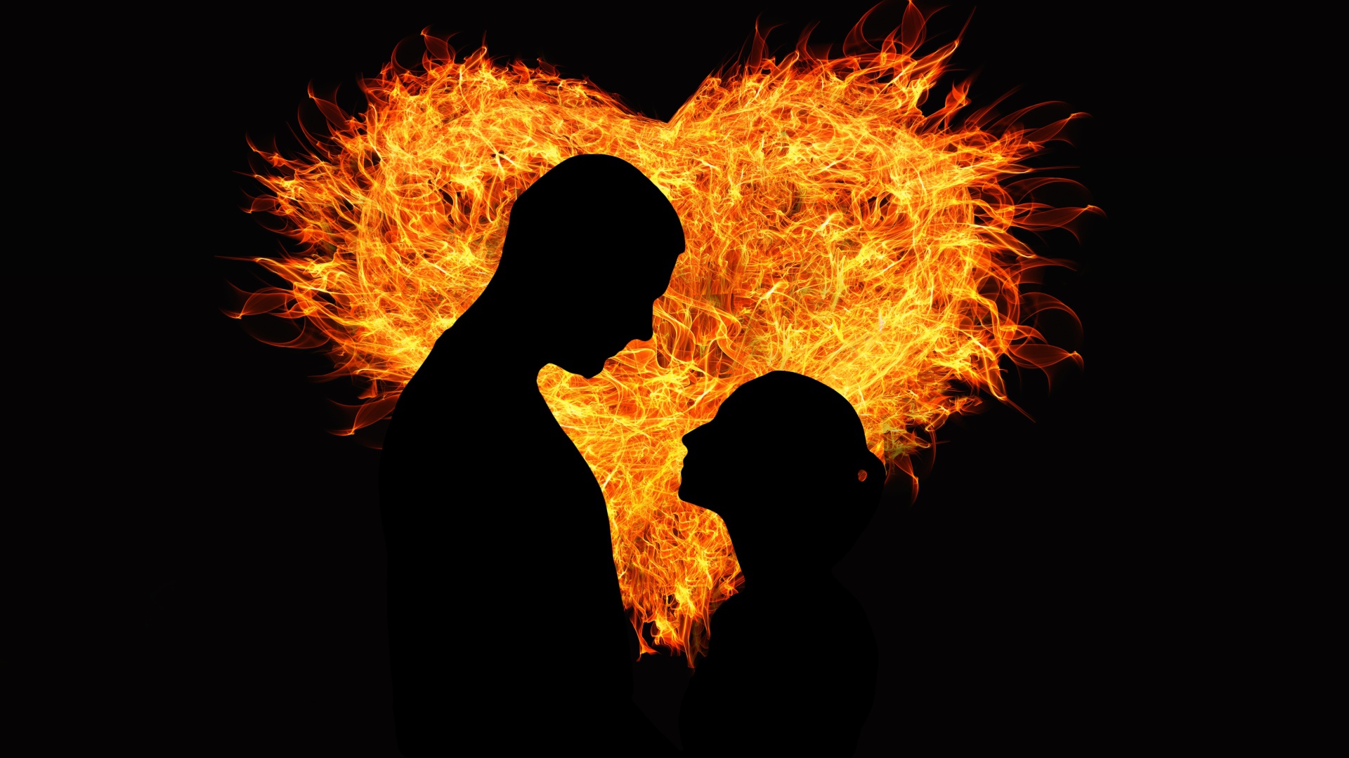 Влюбленная пара на фоне огненного сердца на черном фоне