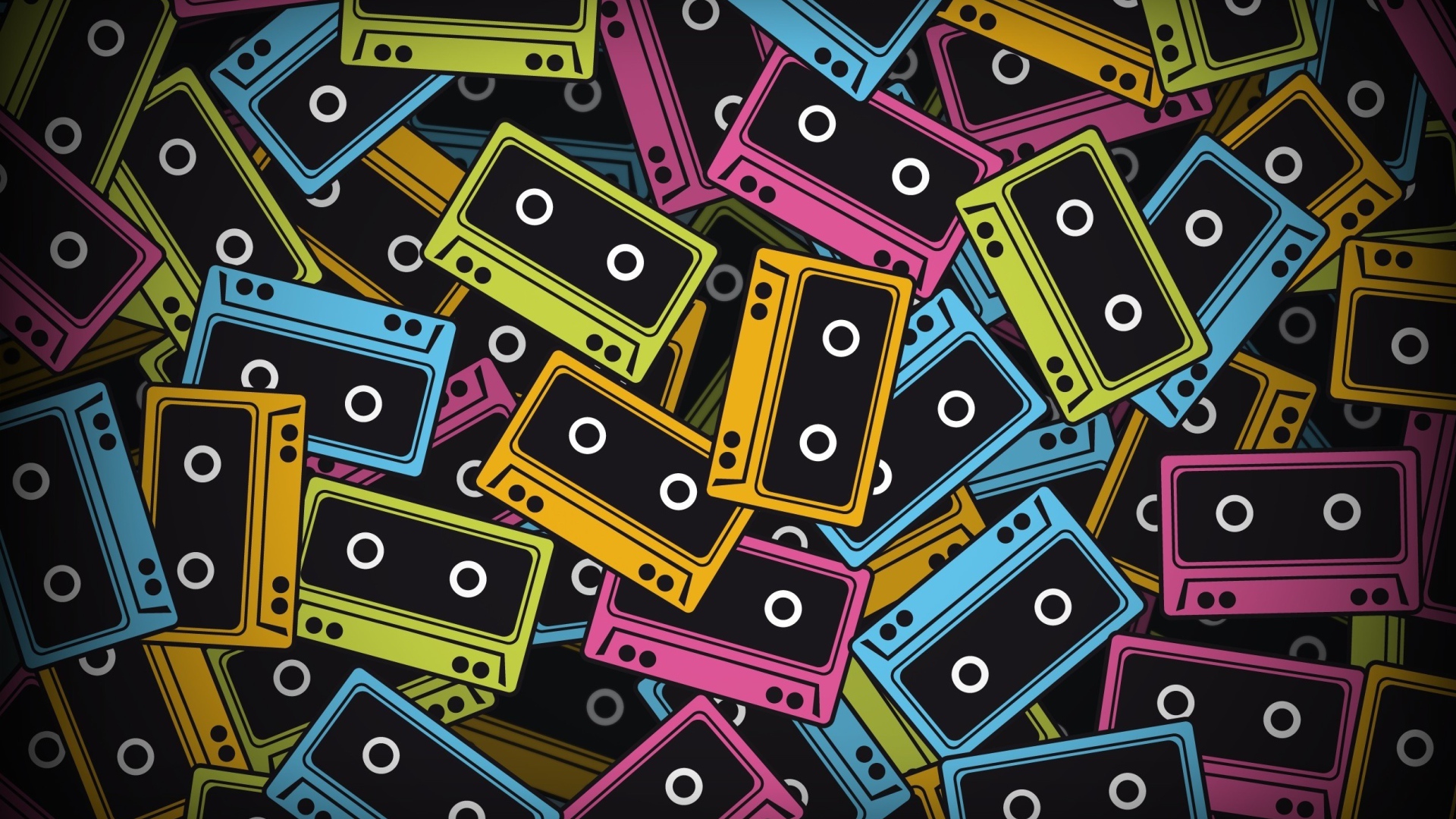 Разноцветные кассеты на черном фоне 