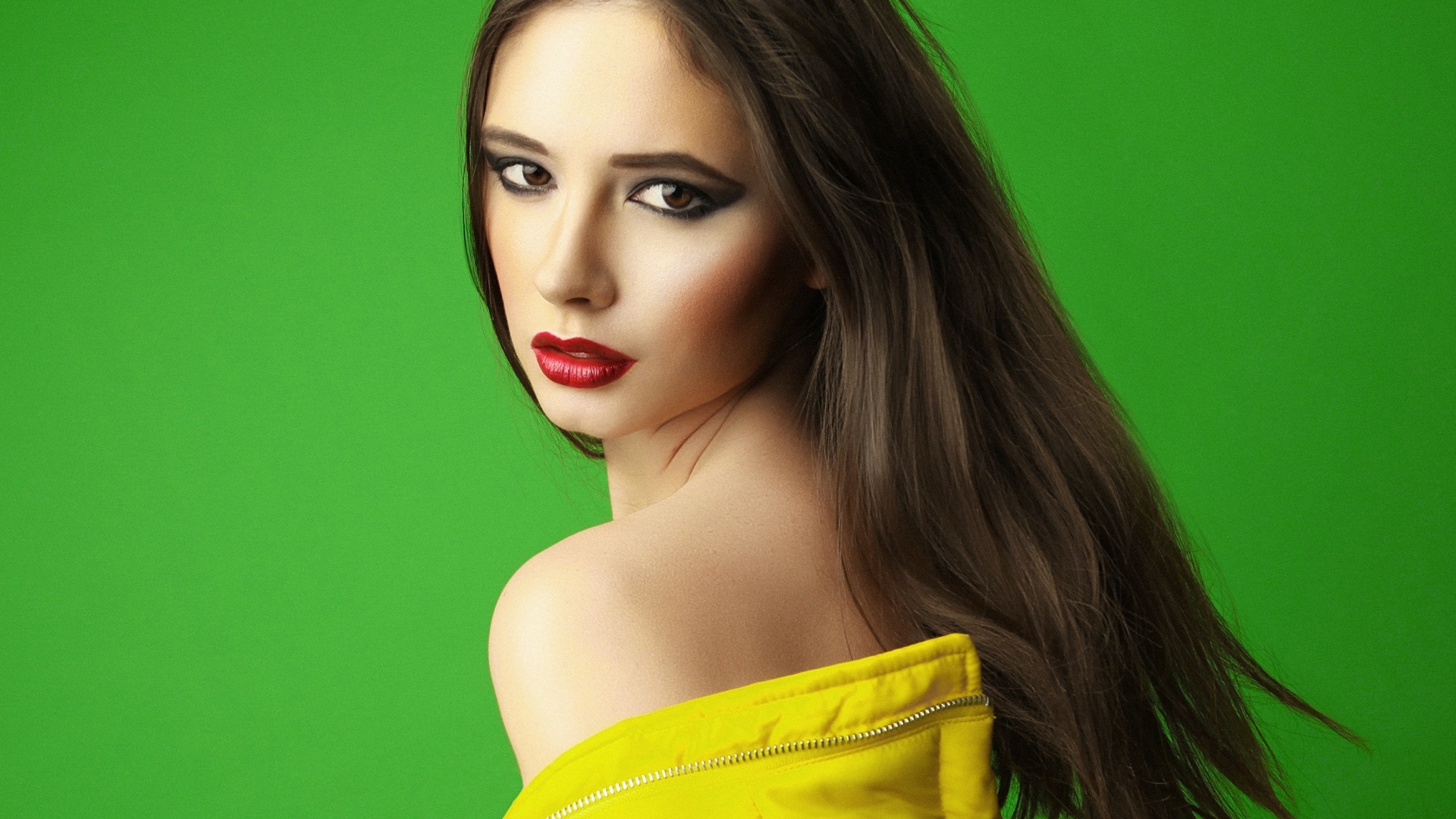 Beautiful girl on a green background