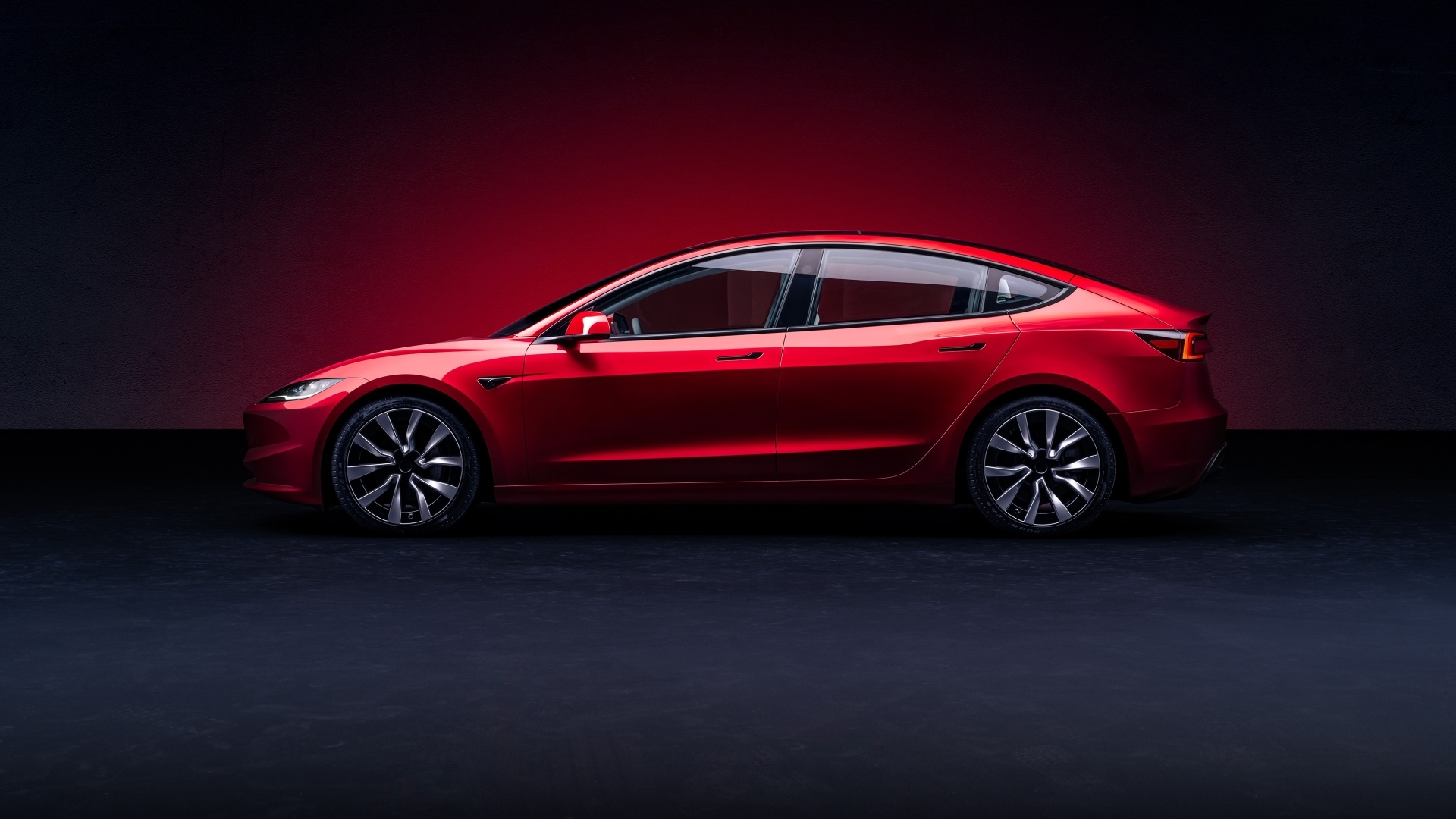 Автомобиль Tesla Model 3 2023 года вид сбоку