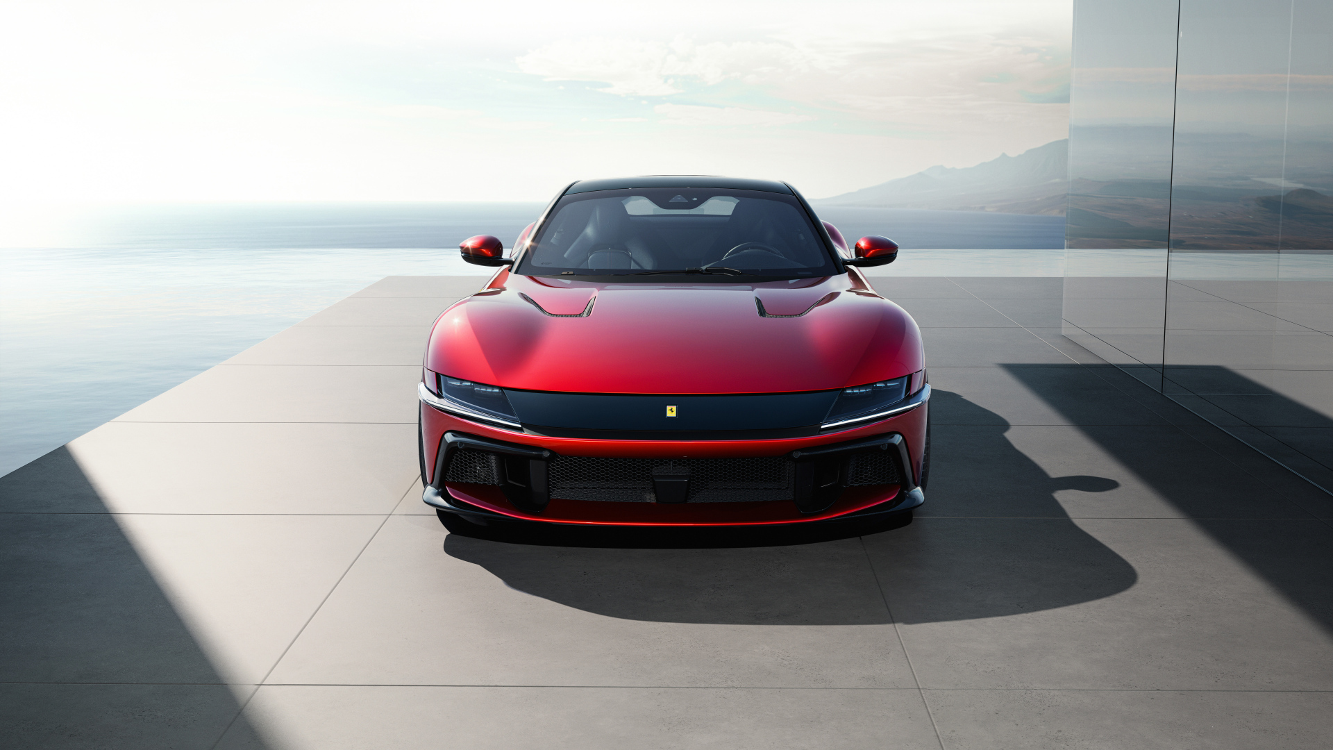 Красный автомобиль  Ferrari 12Cilindri 2024 года вид спереди