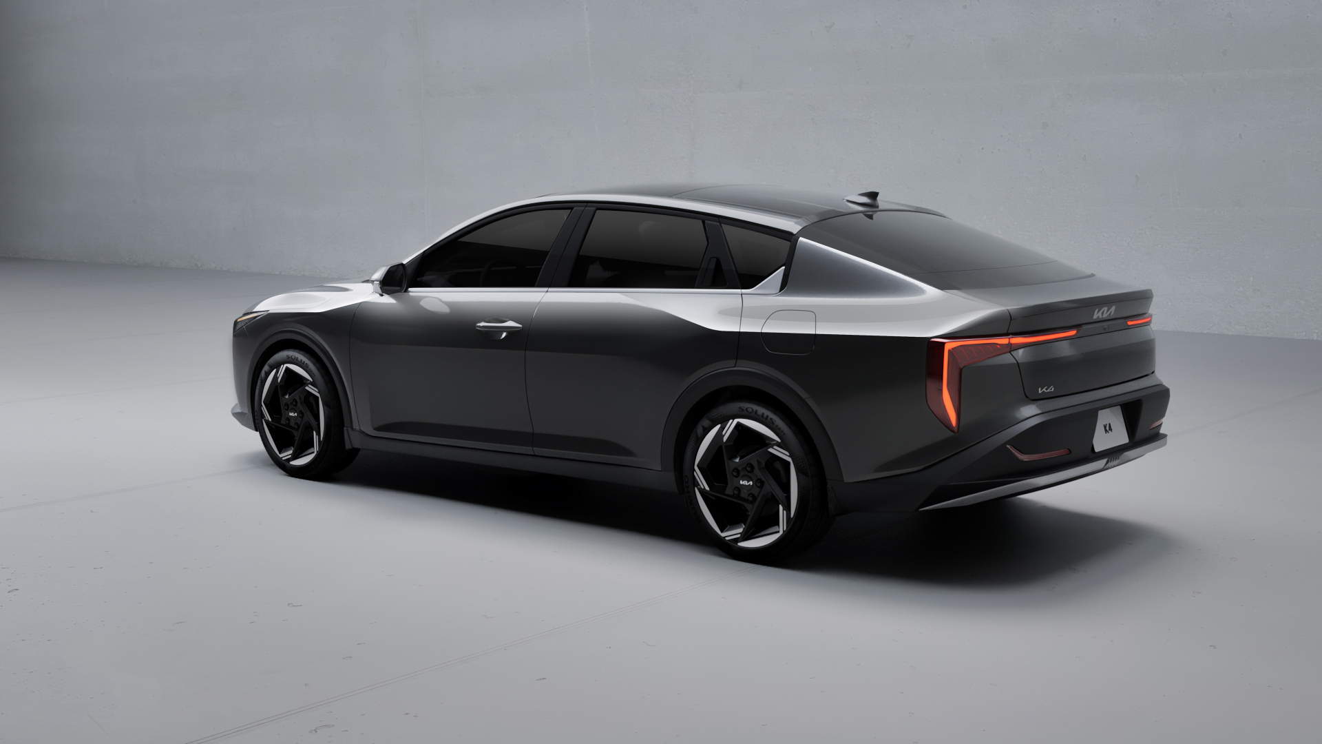 Черный автомобиль Kia K4 2025 года вид сзади