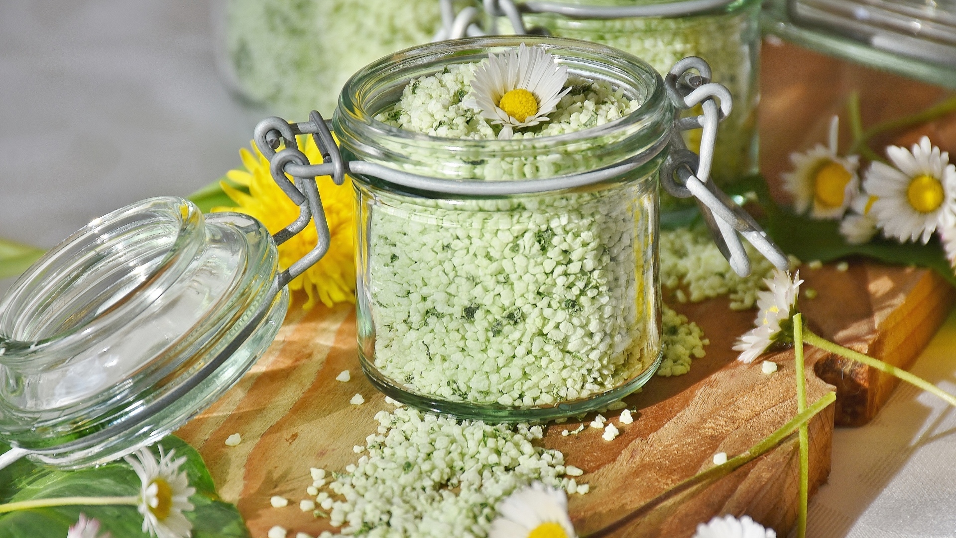 Salt in a jar with chamomile flowers