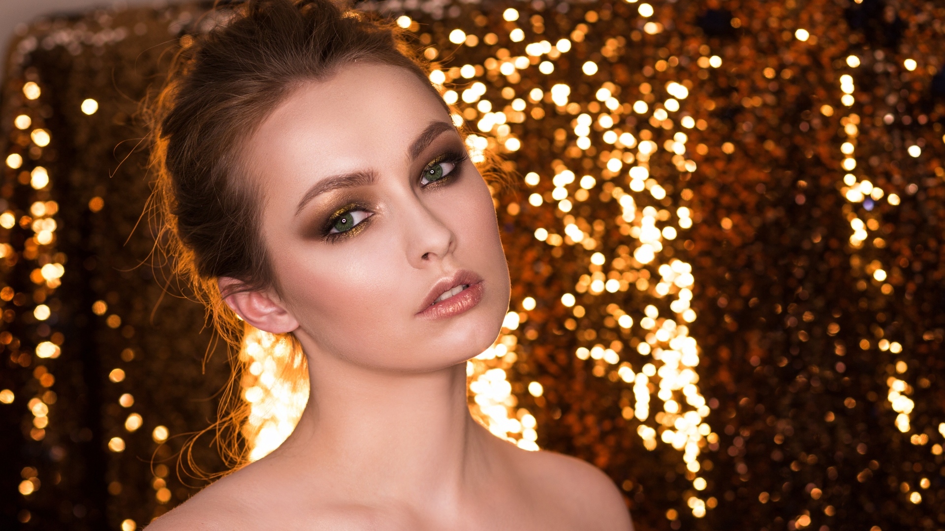 Beautiful girl model on a shiny background