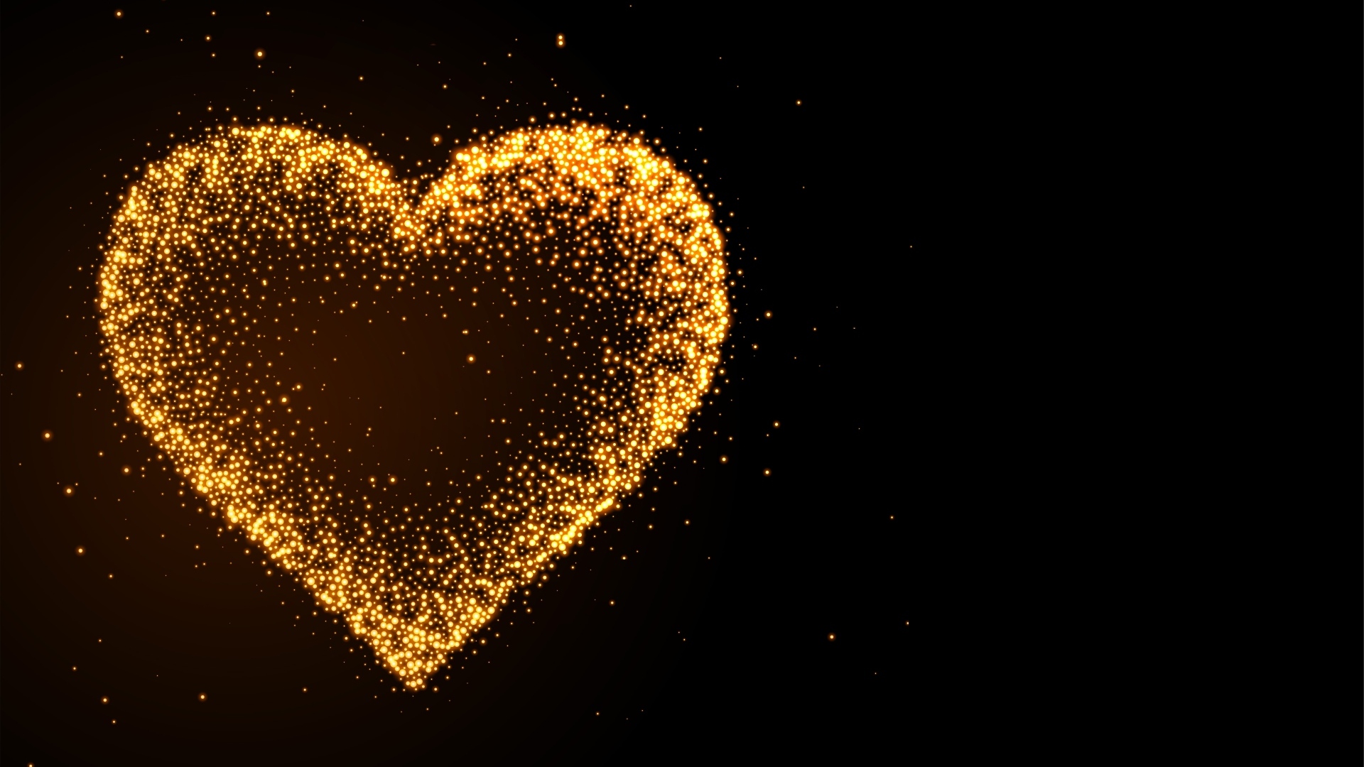 Яркое золотое сердце на черном фоне