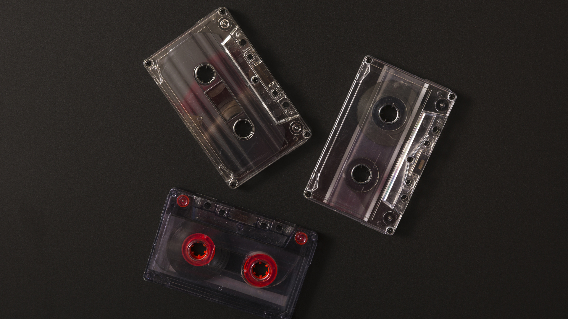Три кассеты на черном фоне