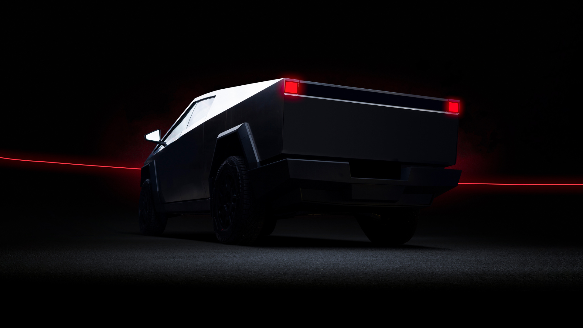 Вид сзади на автомобиль Tesla Cybertruck Dark