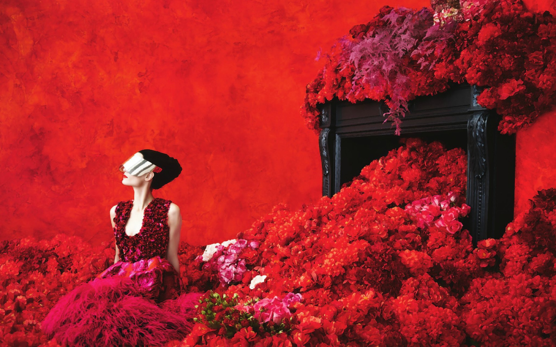 Девушка в красных цветах на красном фоне
