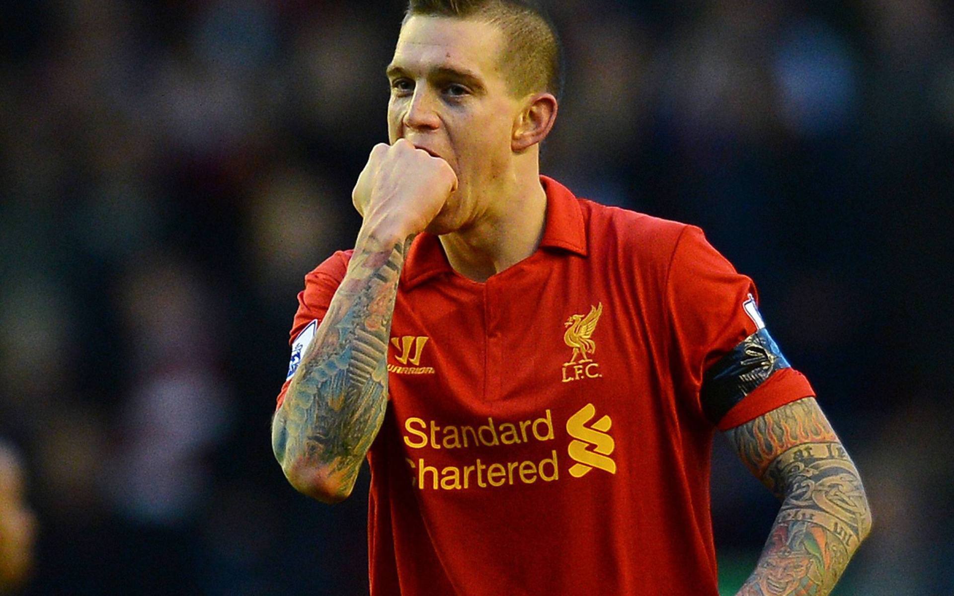The player of Liverpool Daniel Agger is biting his fist