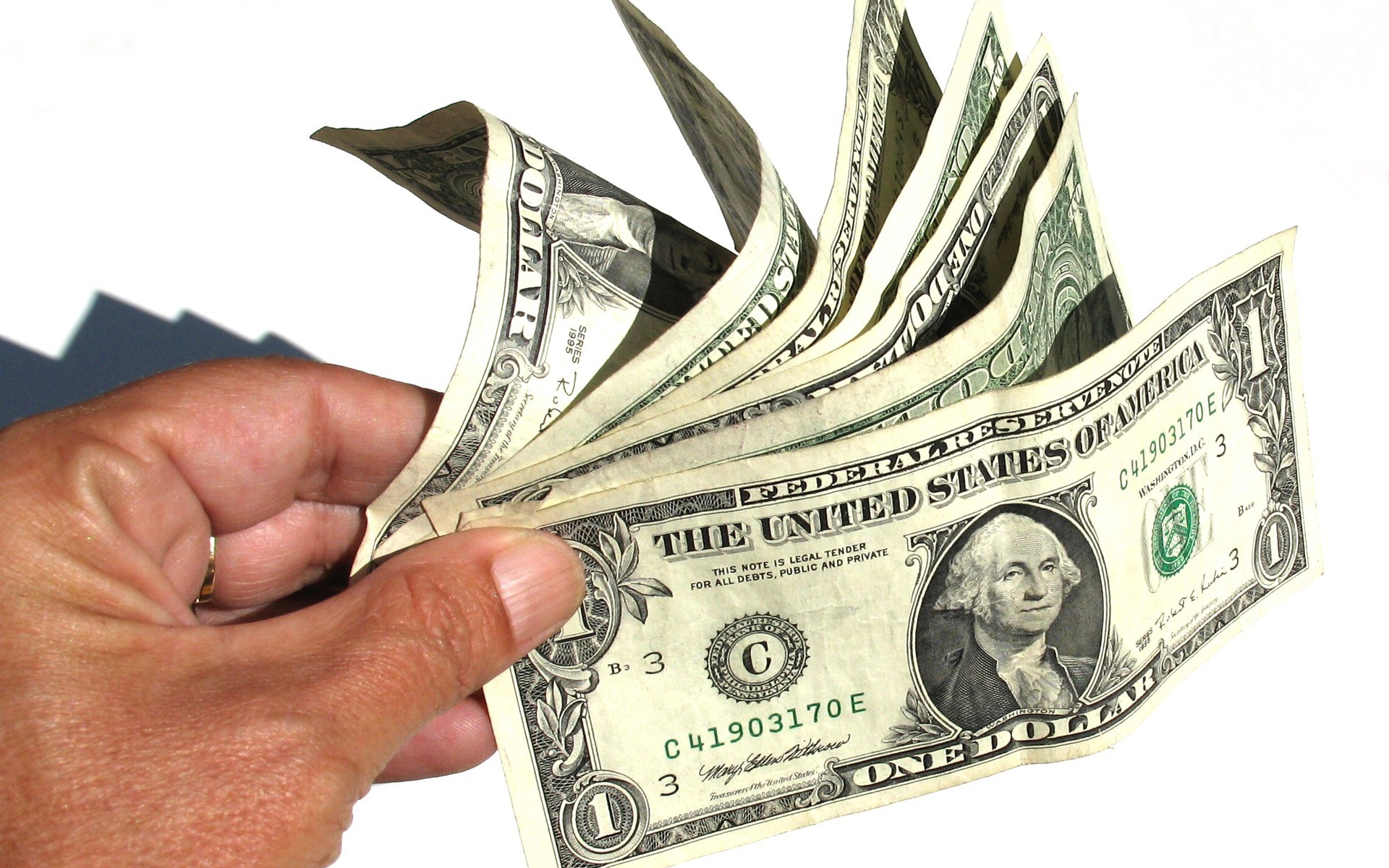 Доллары в руке