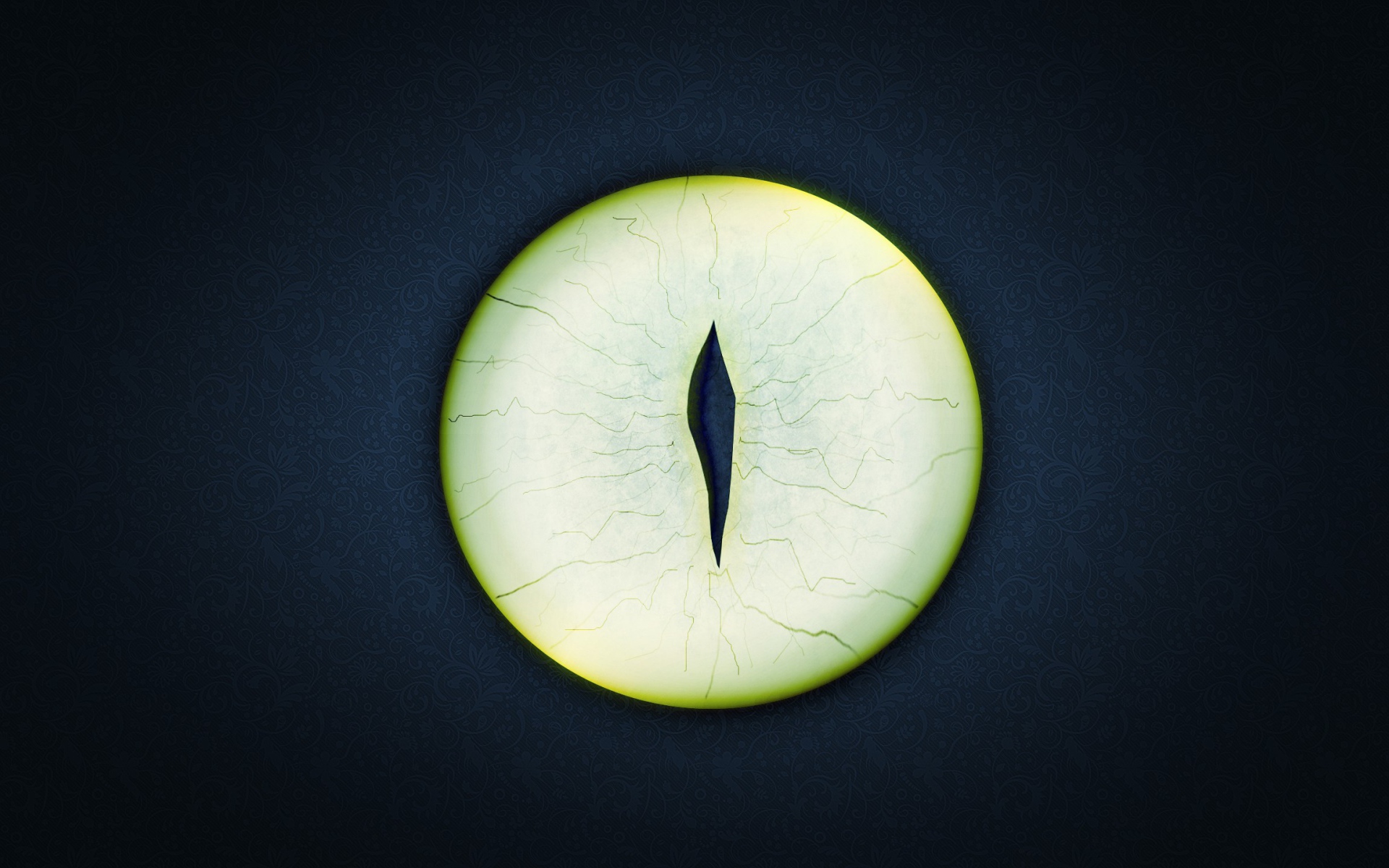 Круглый зеленый глаз на черном фоне