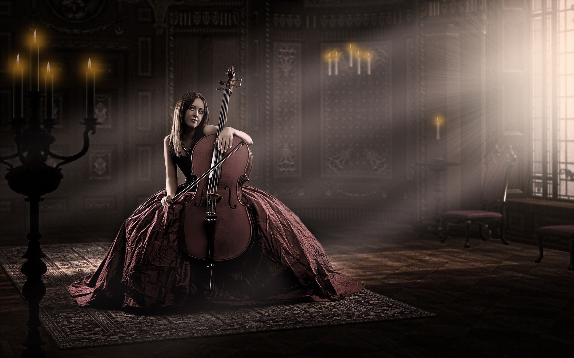 Девушка в роскошном платье играет на виолончели