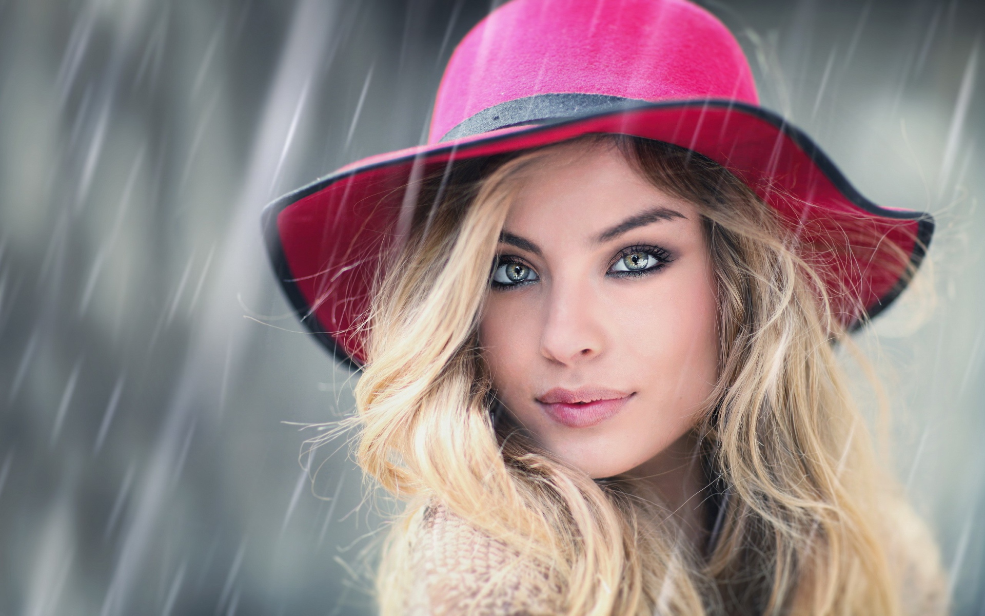 The blonde in a pink hat in the rain