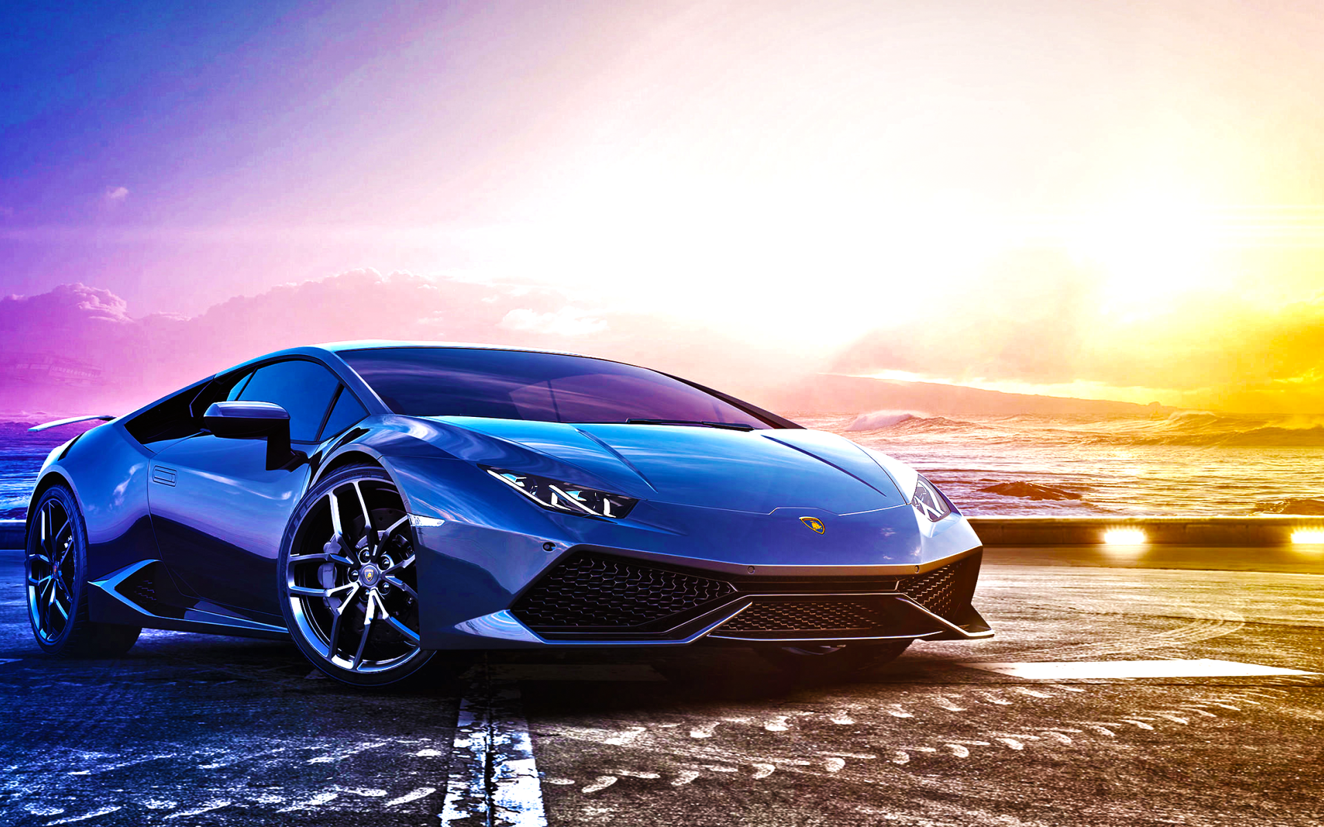 Синий спортивный автомобиль Lamborghini Huracan LP 610-4 на фоне океана 