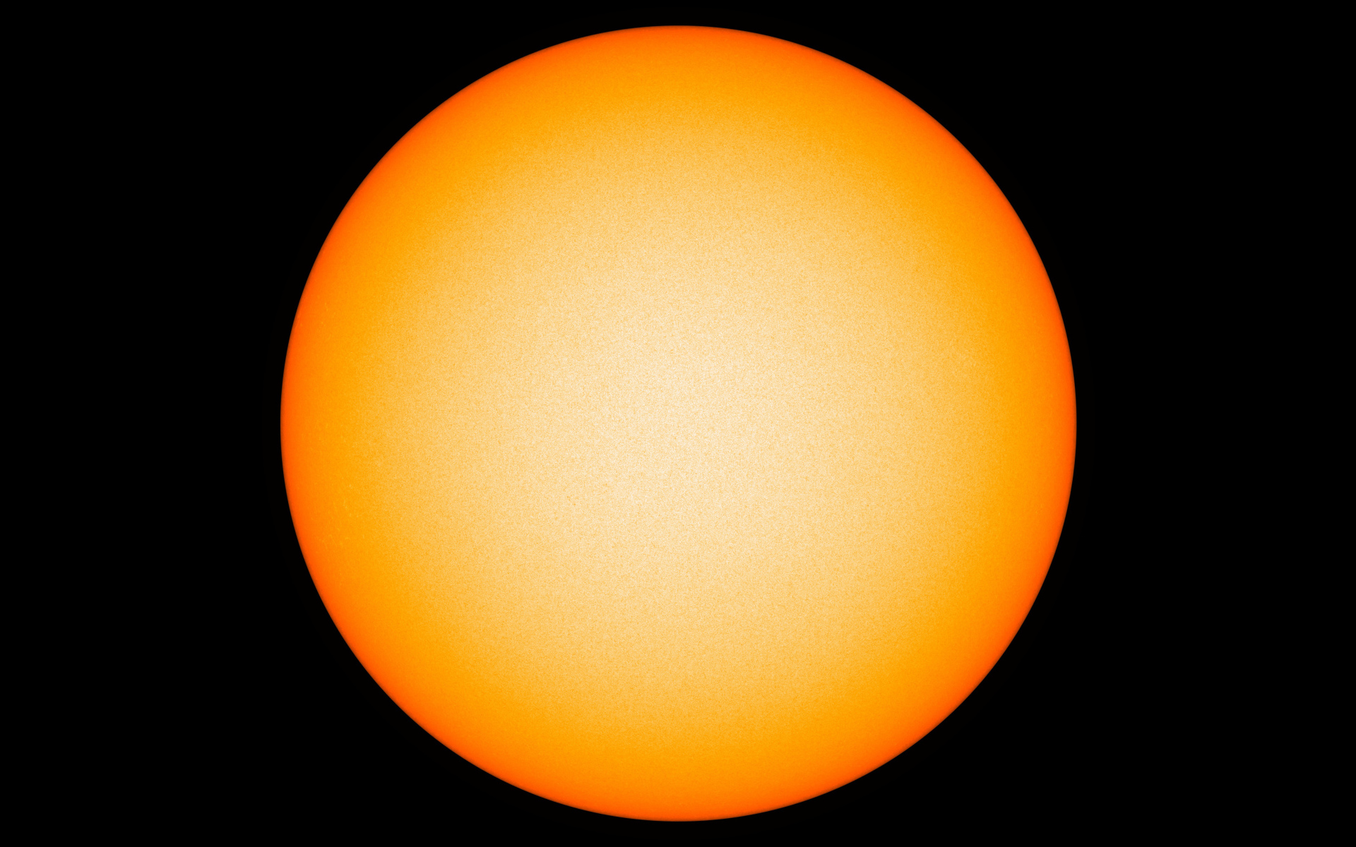 Яркое желтое солнце на черном фоне