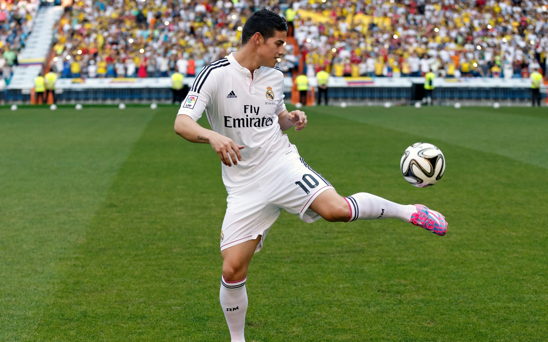 Football player James Rodriguez plays with a ball
