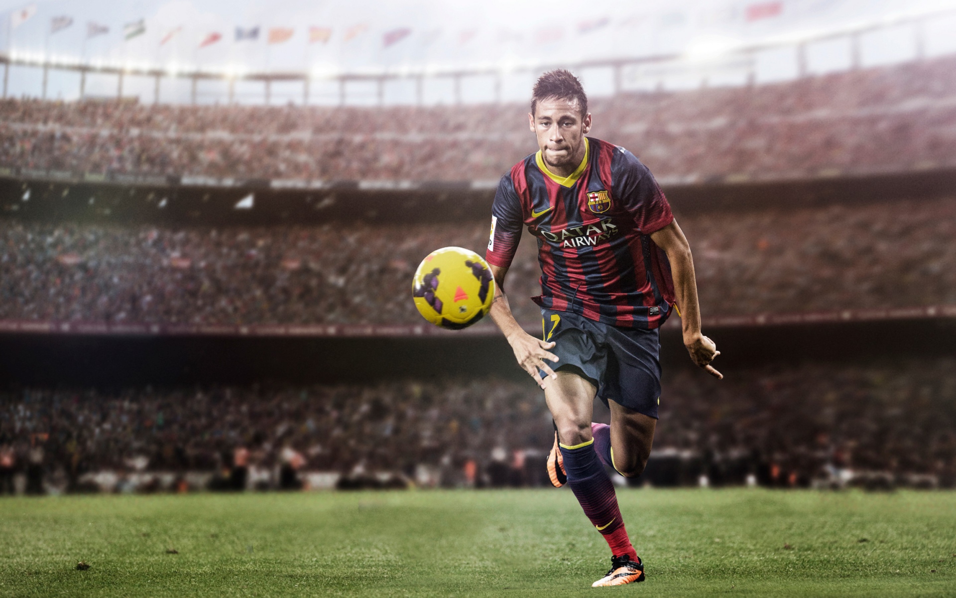 Футболист Неймар на футбольном поле с мячом