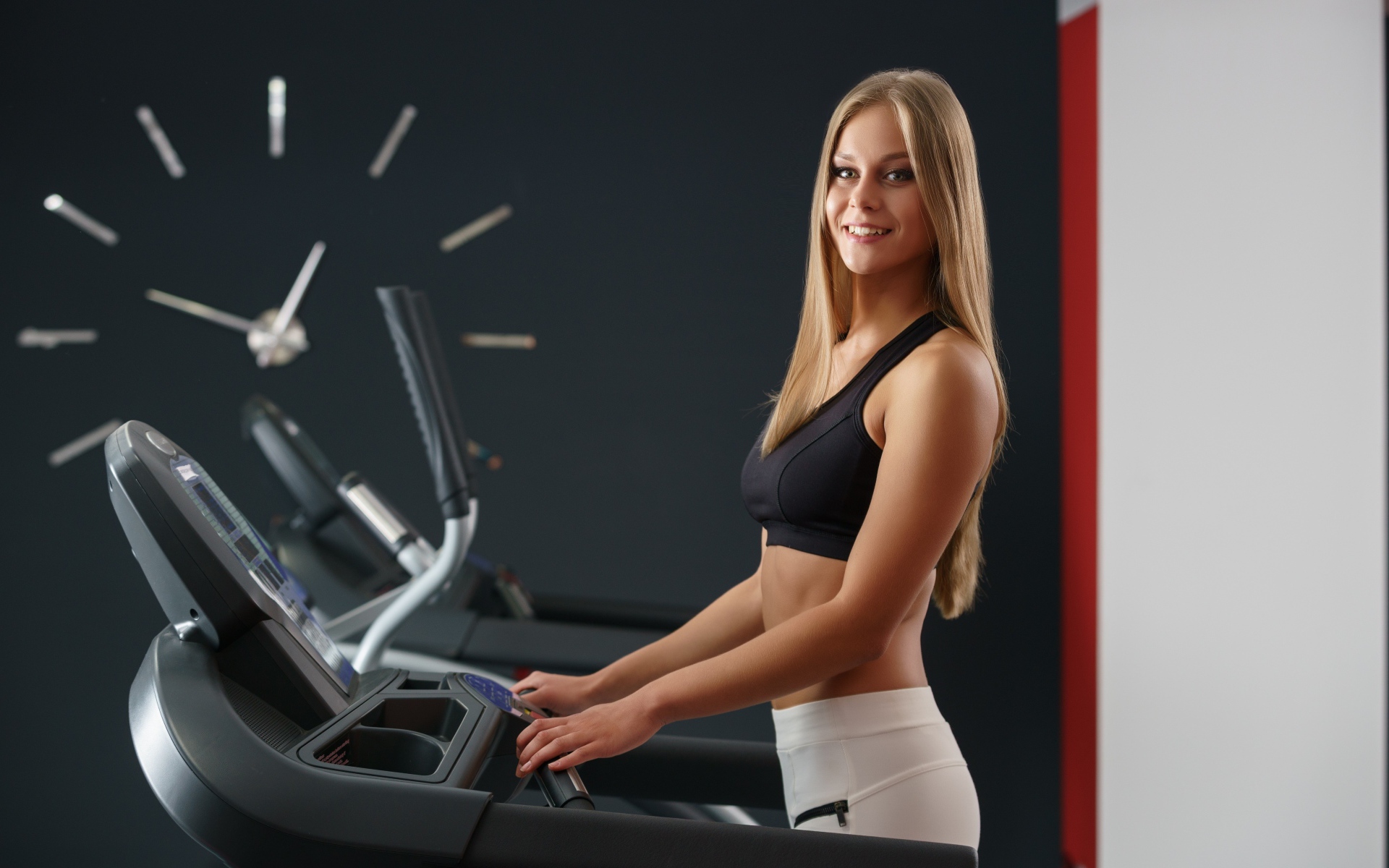 Girl athlete on the treadmill
