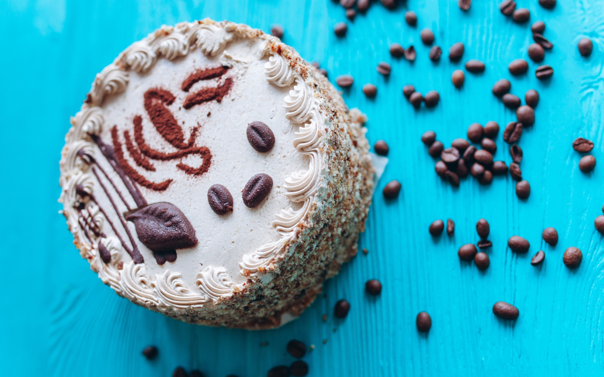 Cake with coffee beans on a blue background