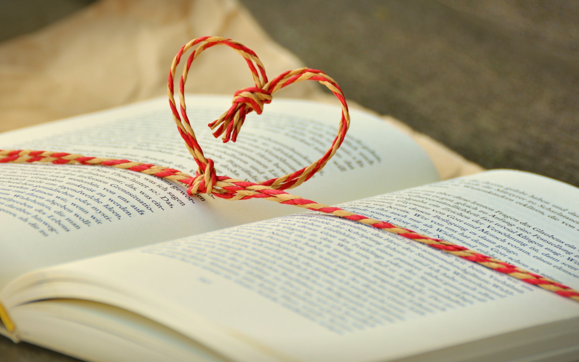 The heart of the rope lies on an open book