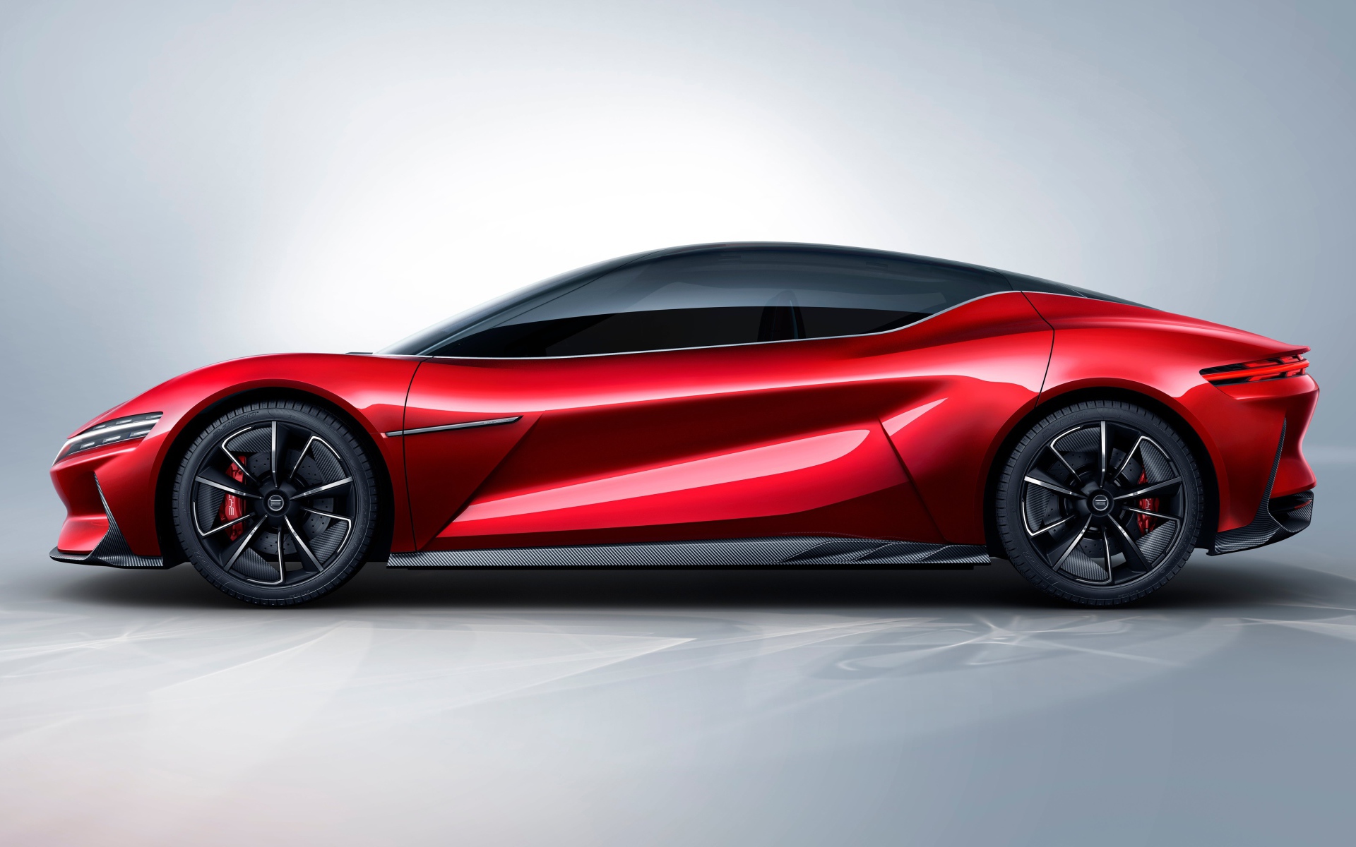 Красный автомобиль BYD E-SEED GT 2019 года на сером фоне