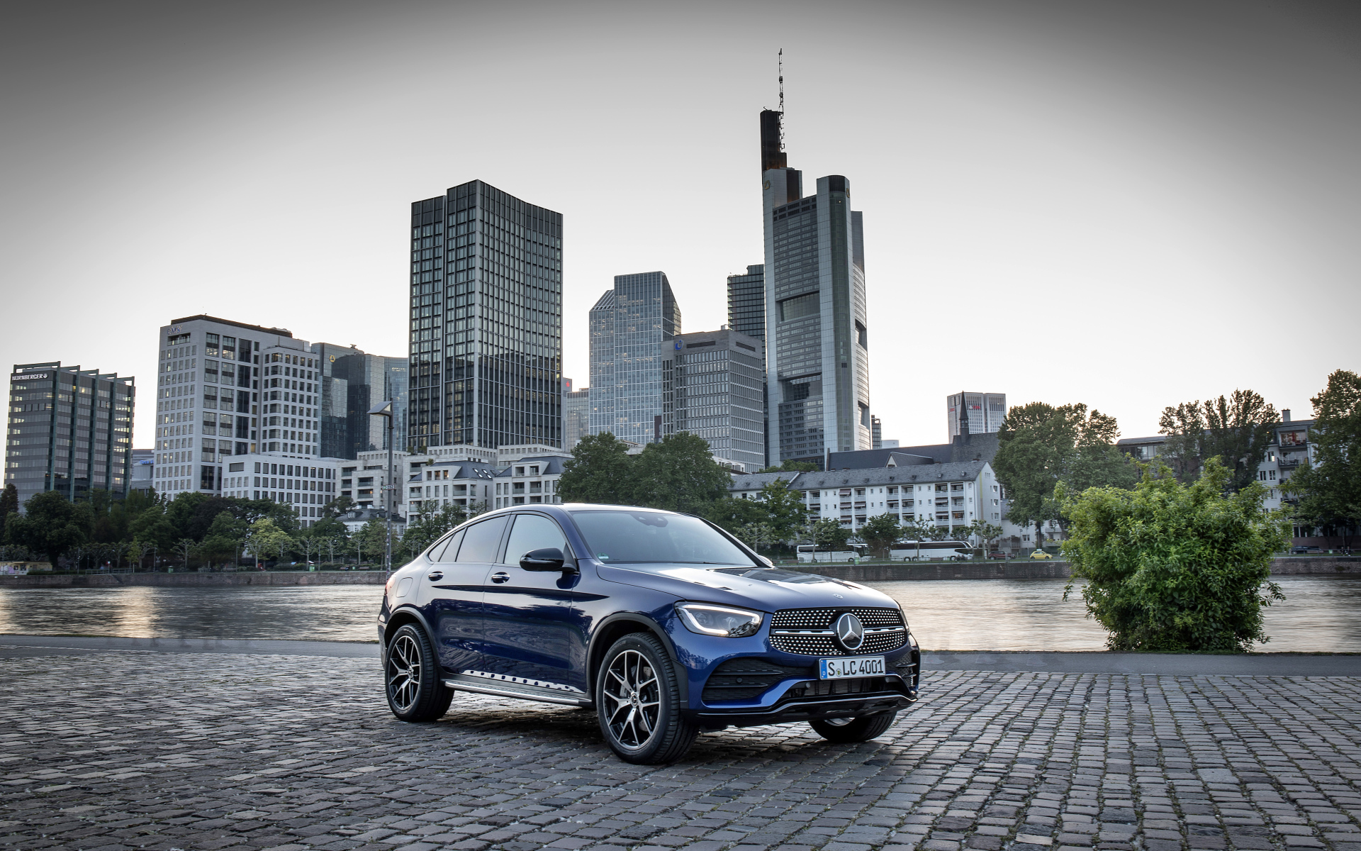 Blue car Mercedes-Benz GLC-Class on the background of skyscrapers