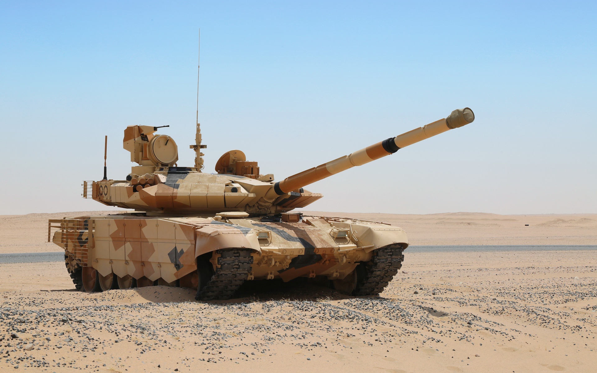 Tank T-90 in the desert against the blue sky