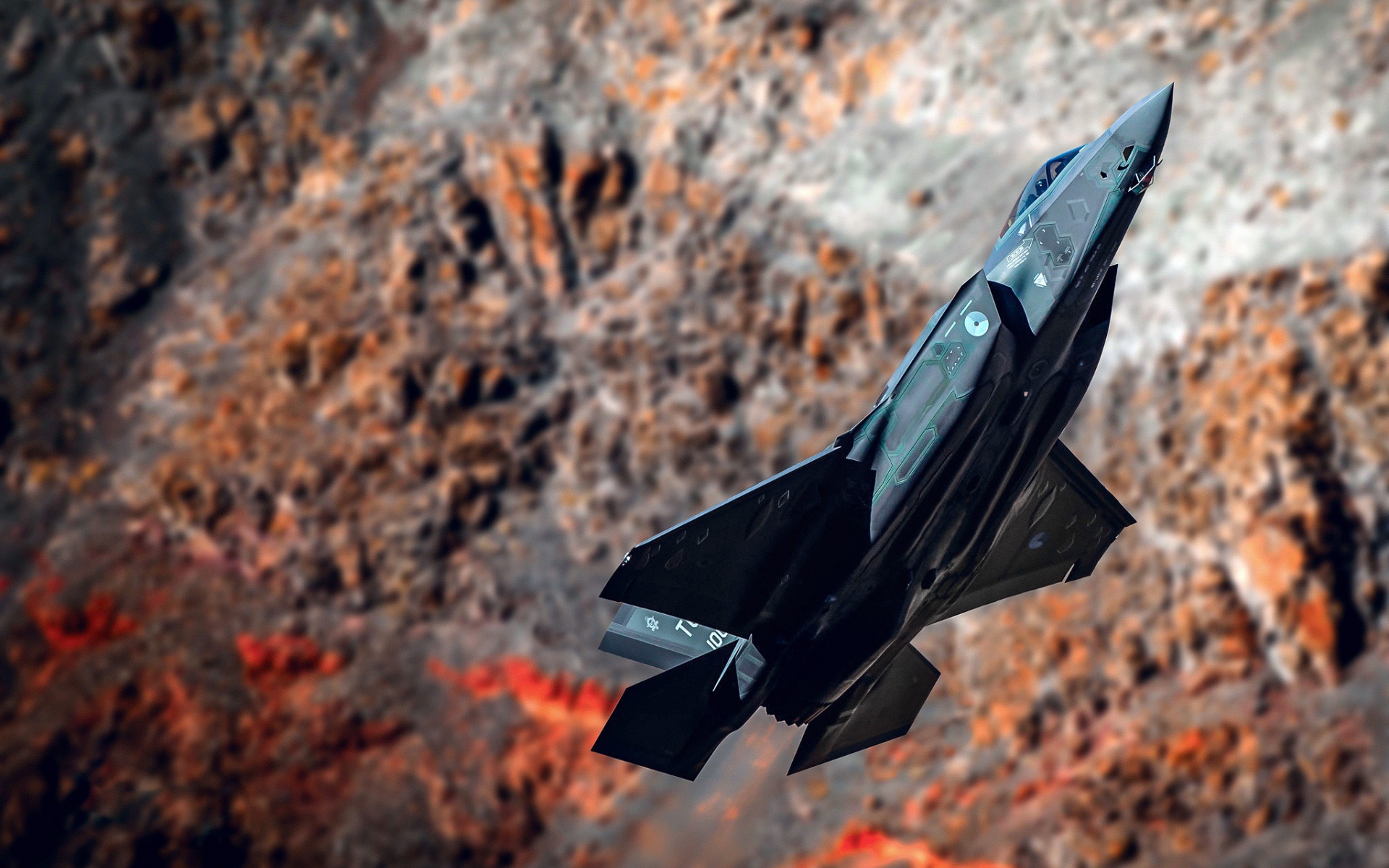 Black fighter F-35A Lightning II on the background of mountains