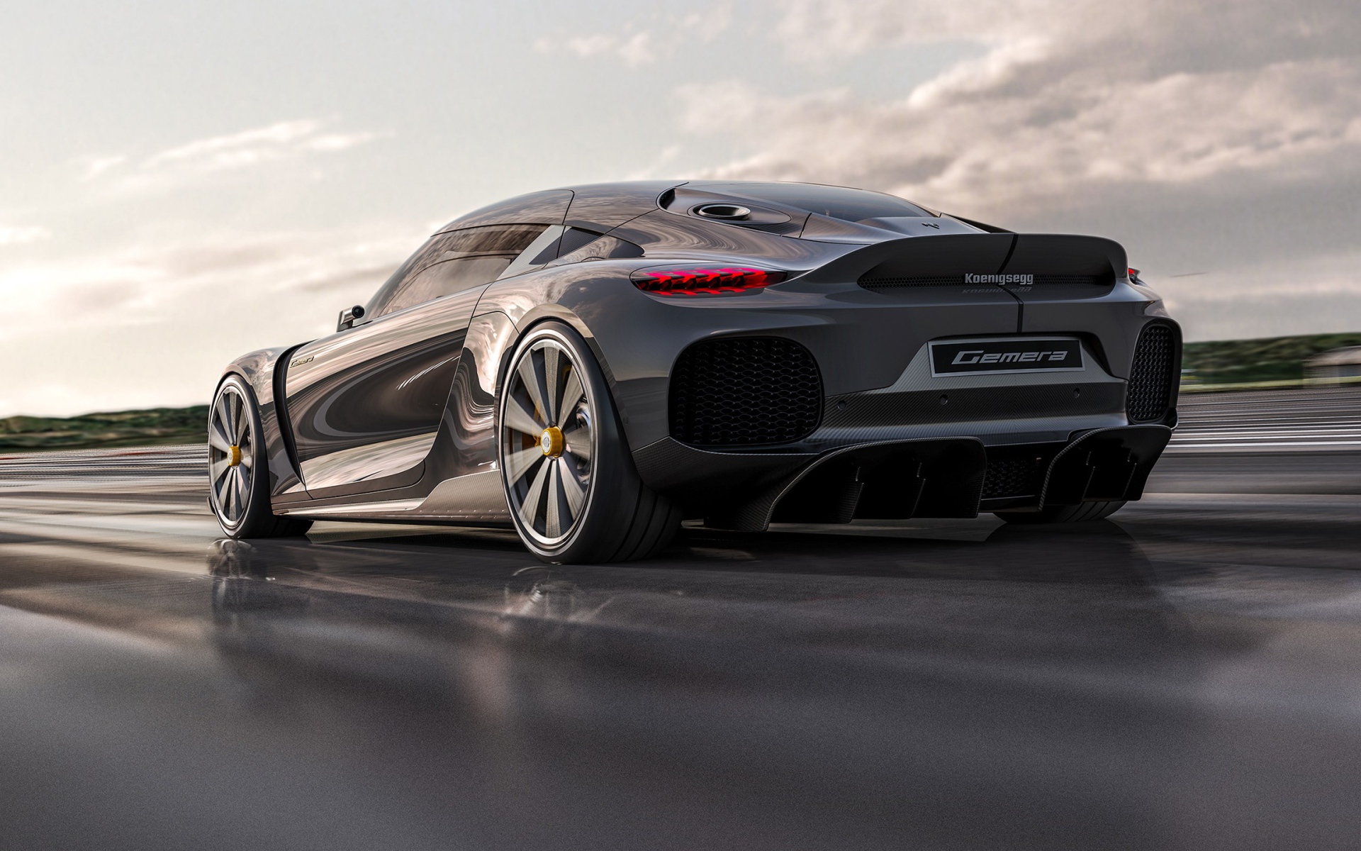 Быстрый автомобиль Koenigsegg Gemera 2020 года на трассе вид сзади