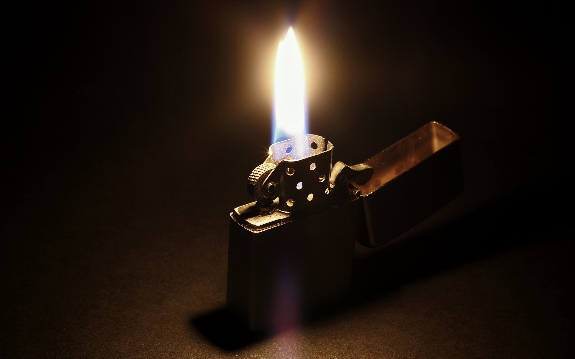 Fire on a lit Zippo lighter