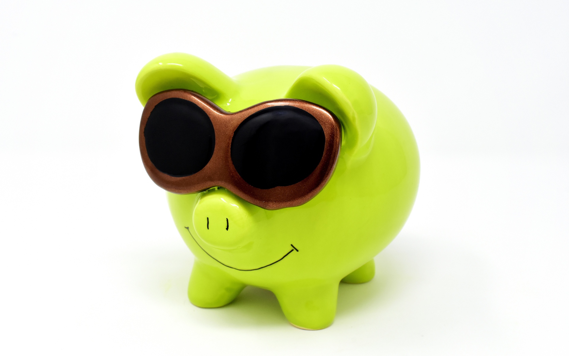 Light green pig piggy bank in glasses on a white background