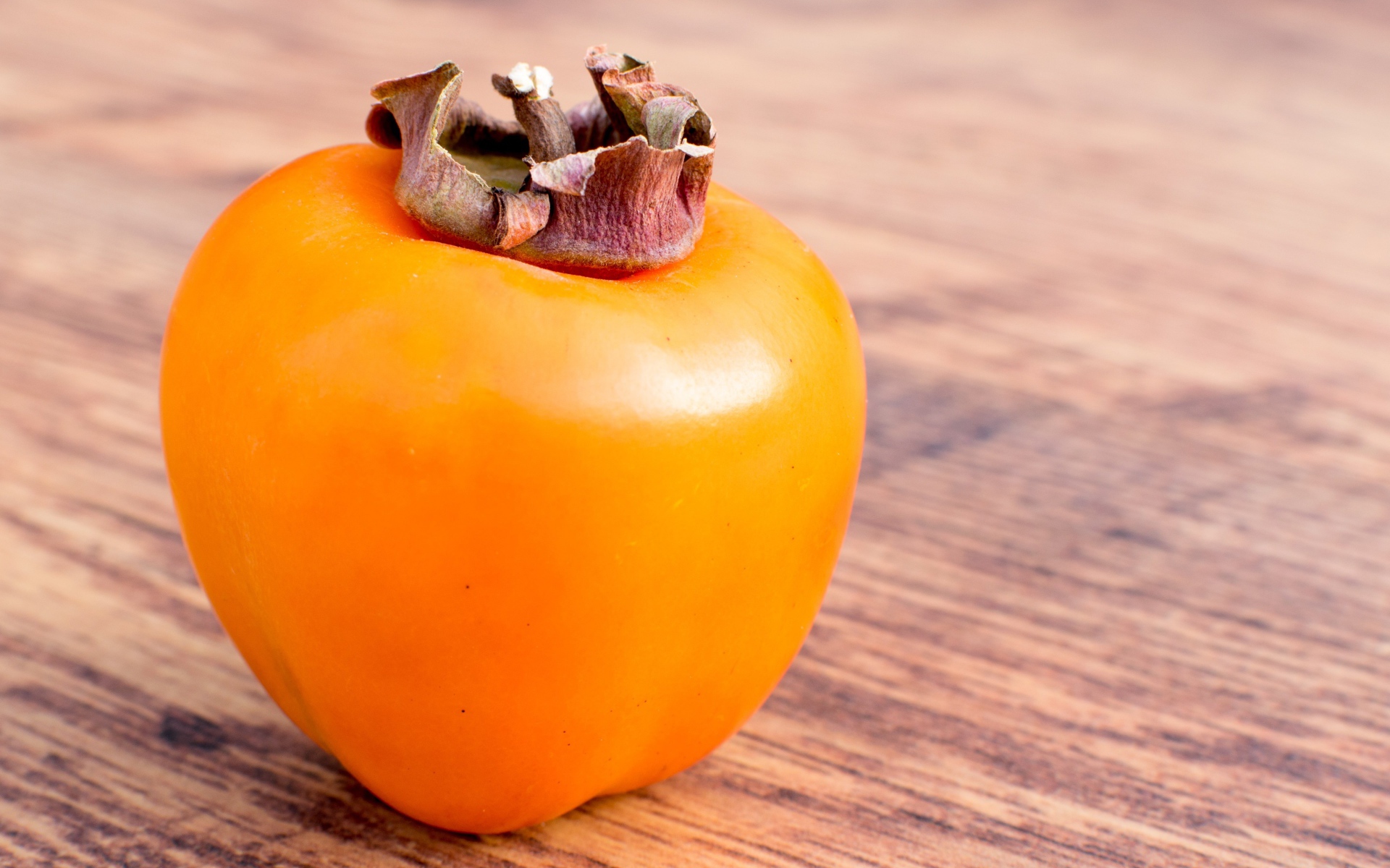 Ripe juicy persimmon on the table