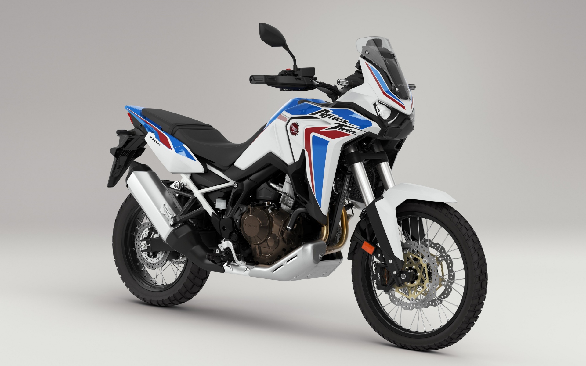Мотоцикл Honda CRF 1000 D AFRICA TWIN, 2020 года на сером фоне