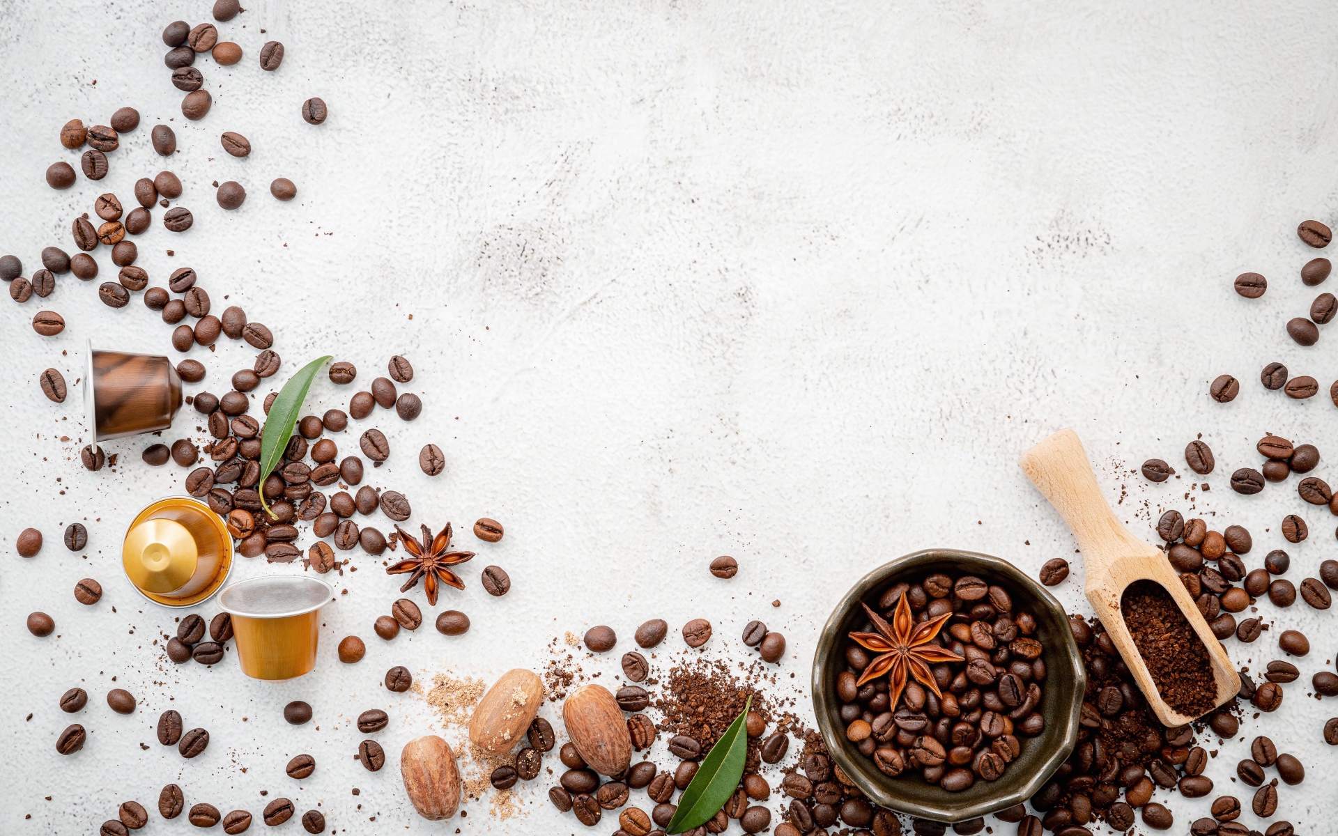 Coffee beans scattered over gray background