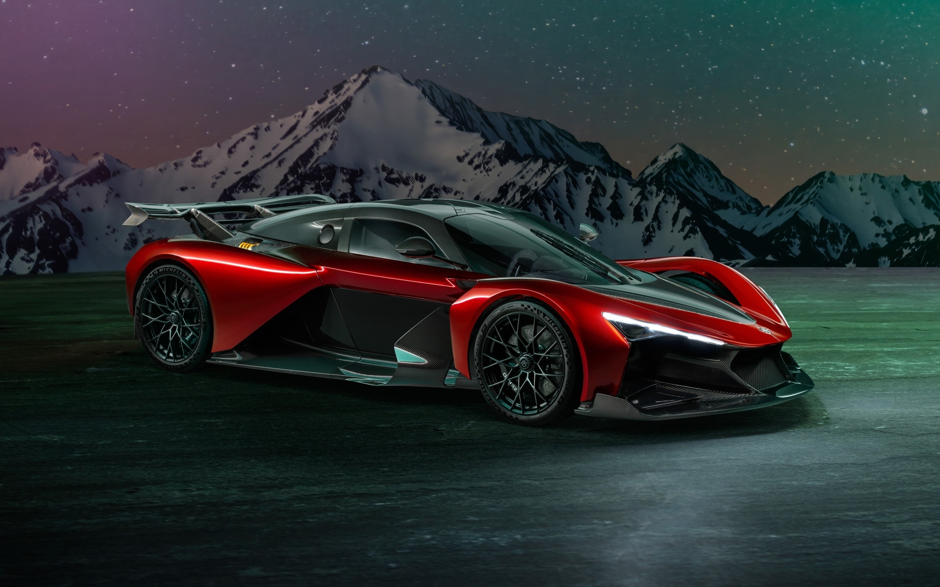 Красный спорткар Zenvo Aurora Agil  на фоне гор