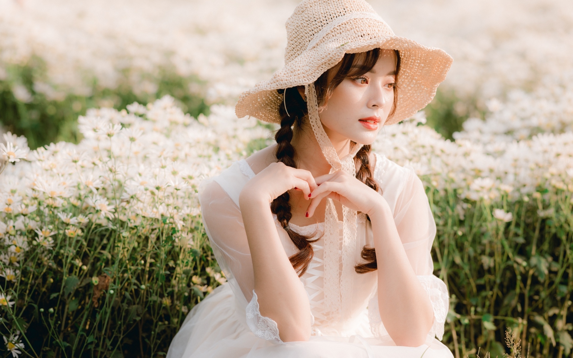 Cute asian woman in hat and white dress