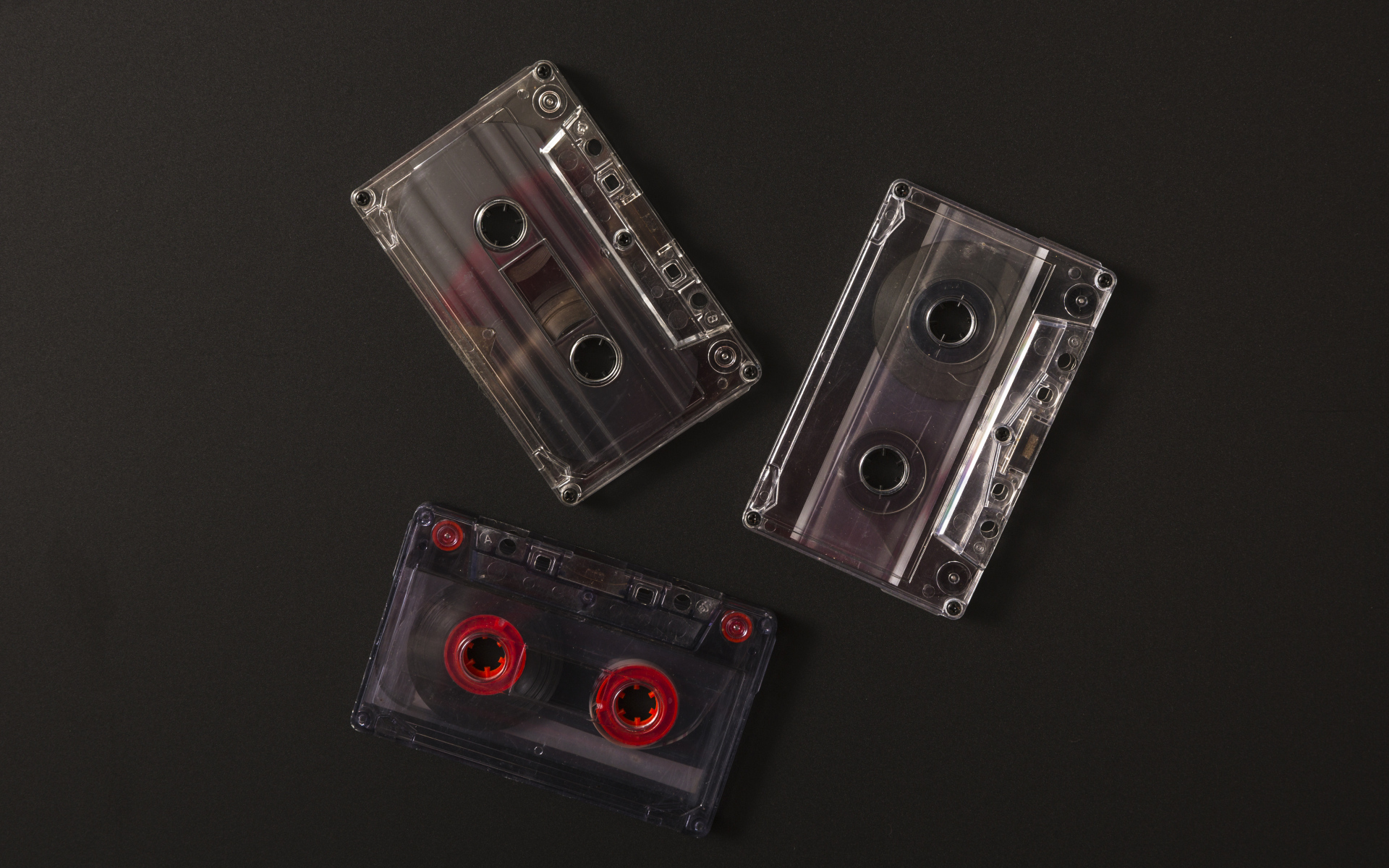 Три кассеты на черном фоне