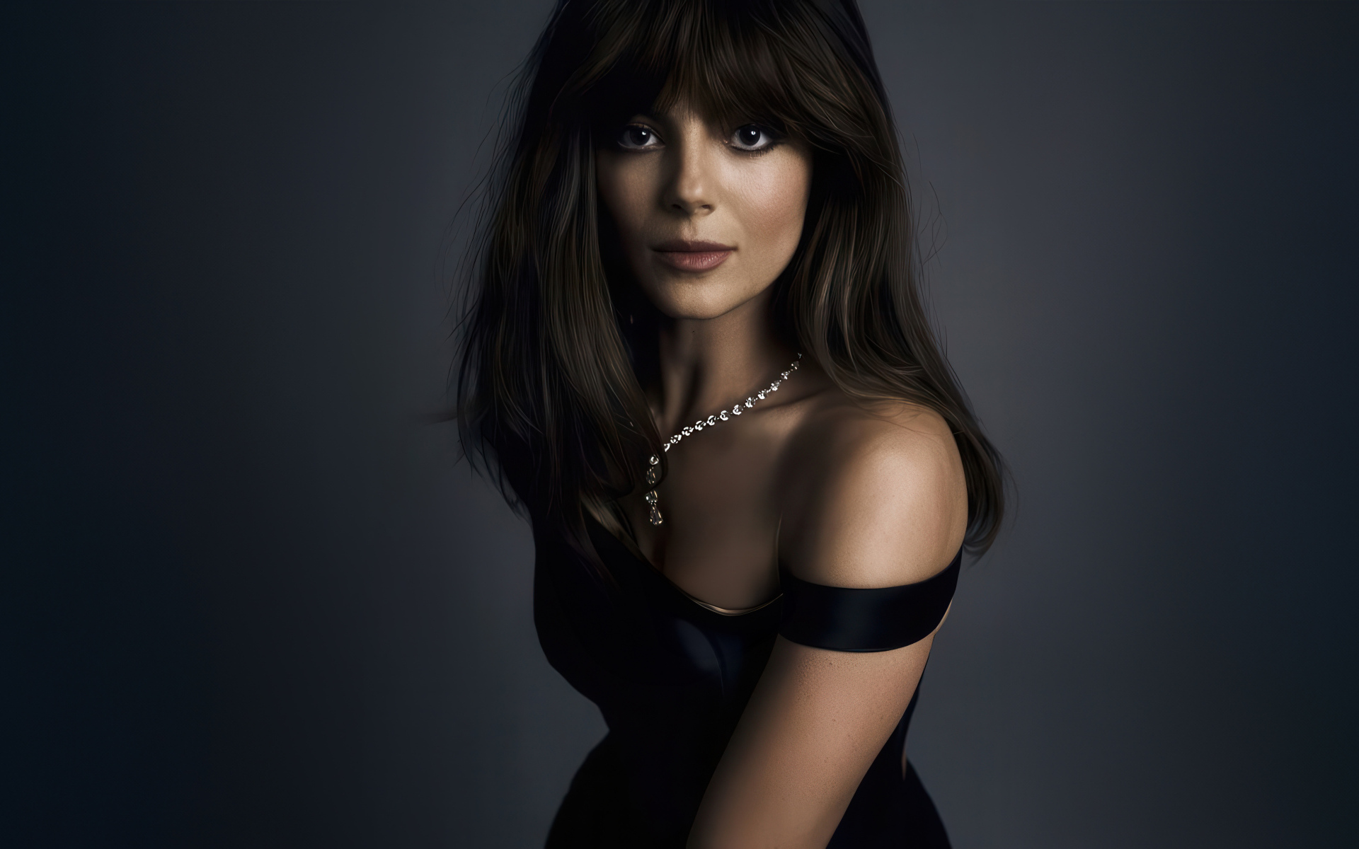 Жгучая брюнетка актриса Моника Барбаро на сером фоне