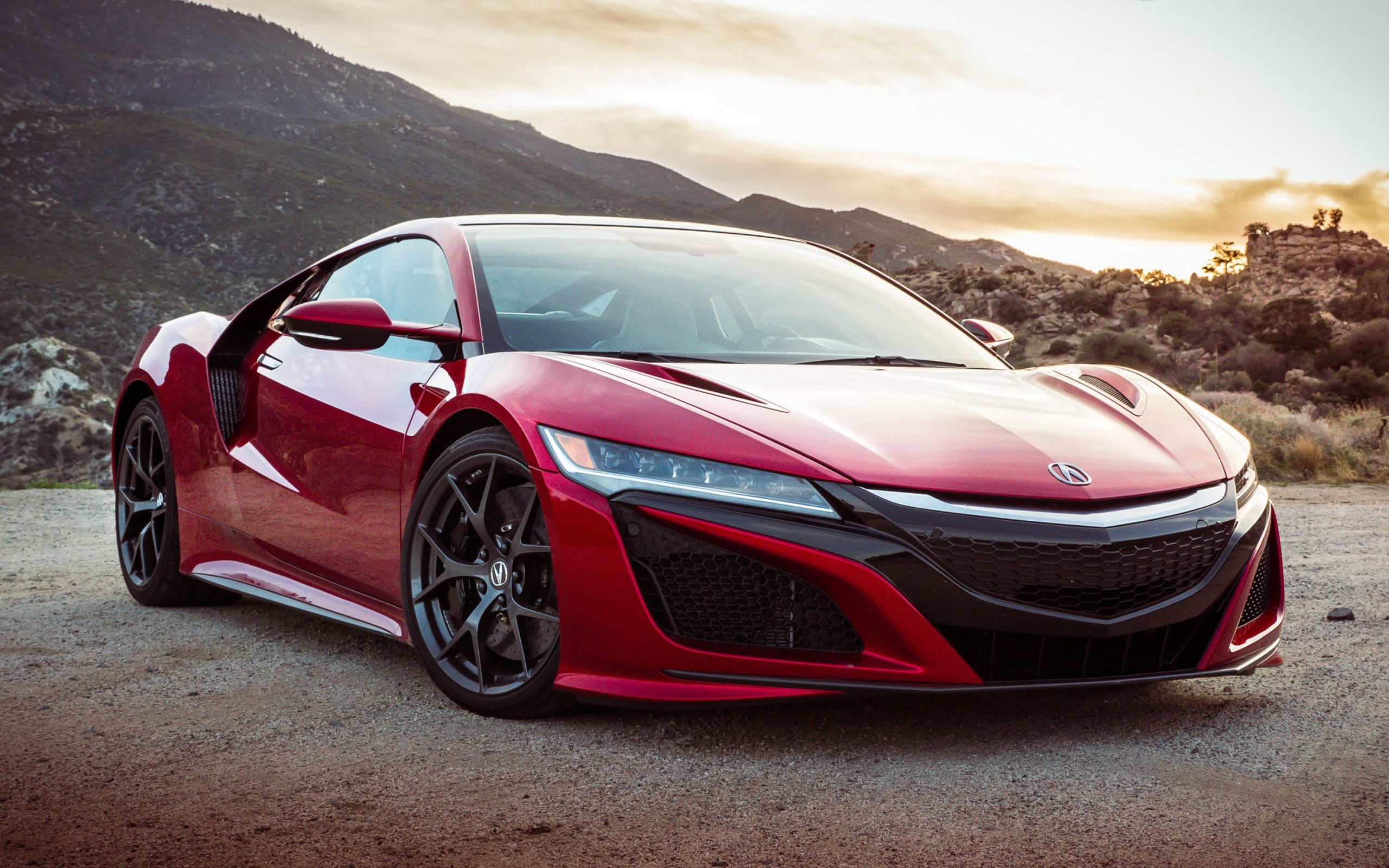 Красный автомобиль Acura NSX, 2017 на фоне гор 