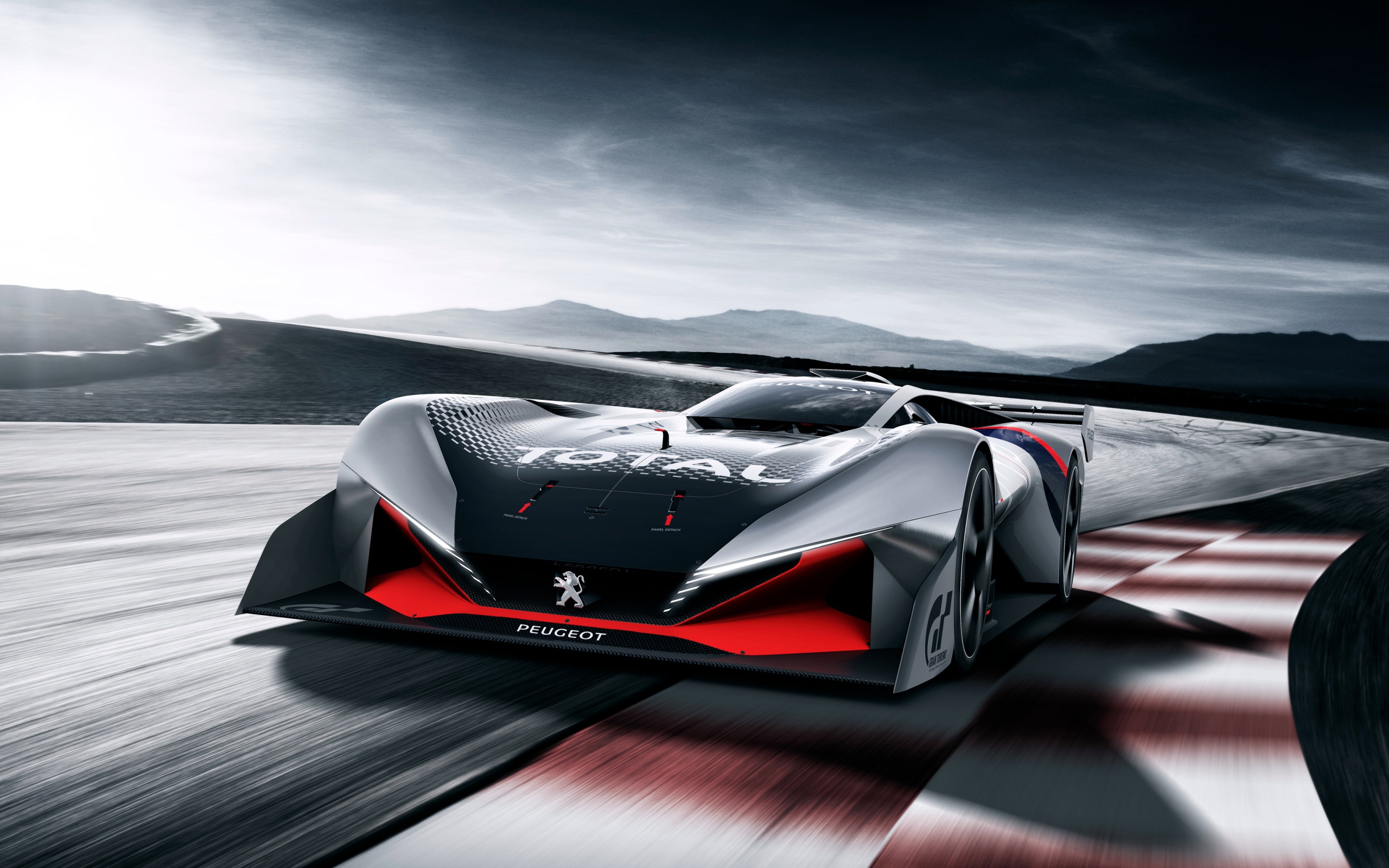 Гоночный автомобиль Peugeot L750 R Hybrid Vision Gran Turismo на трассе