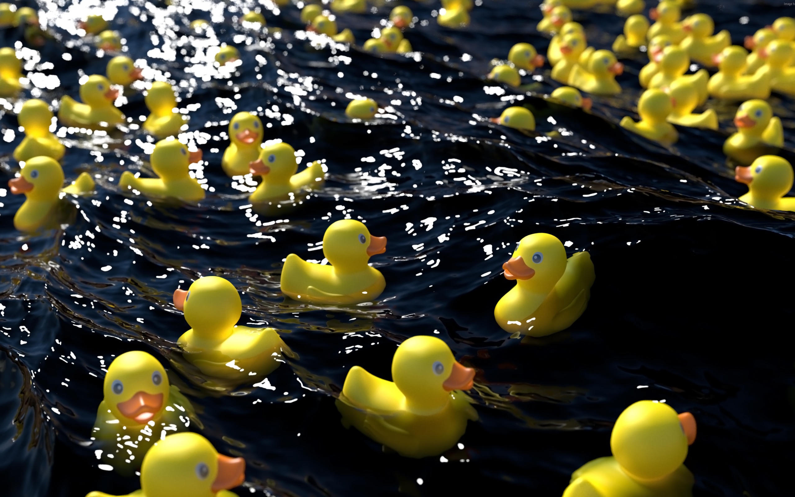 Много желтых резиновых уточек в воде