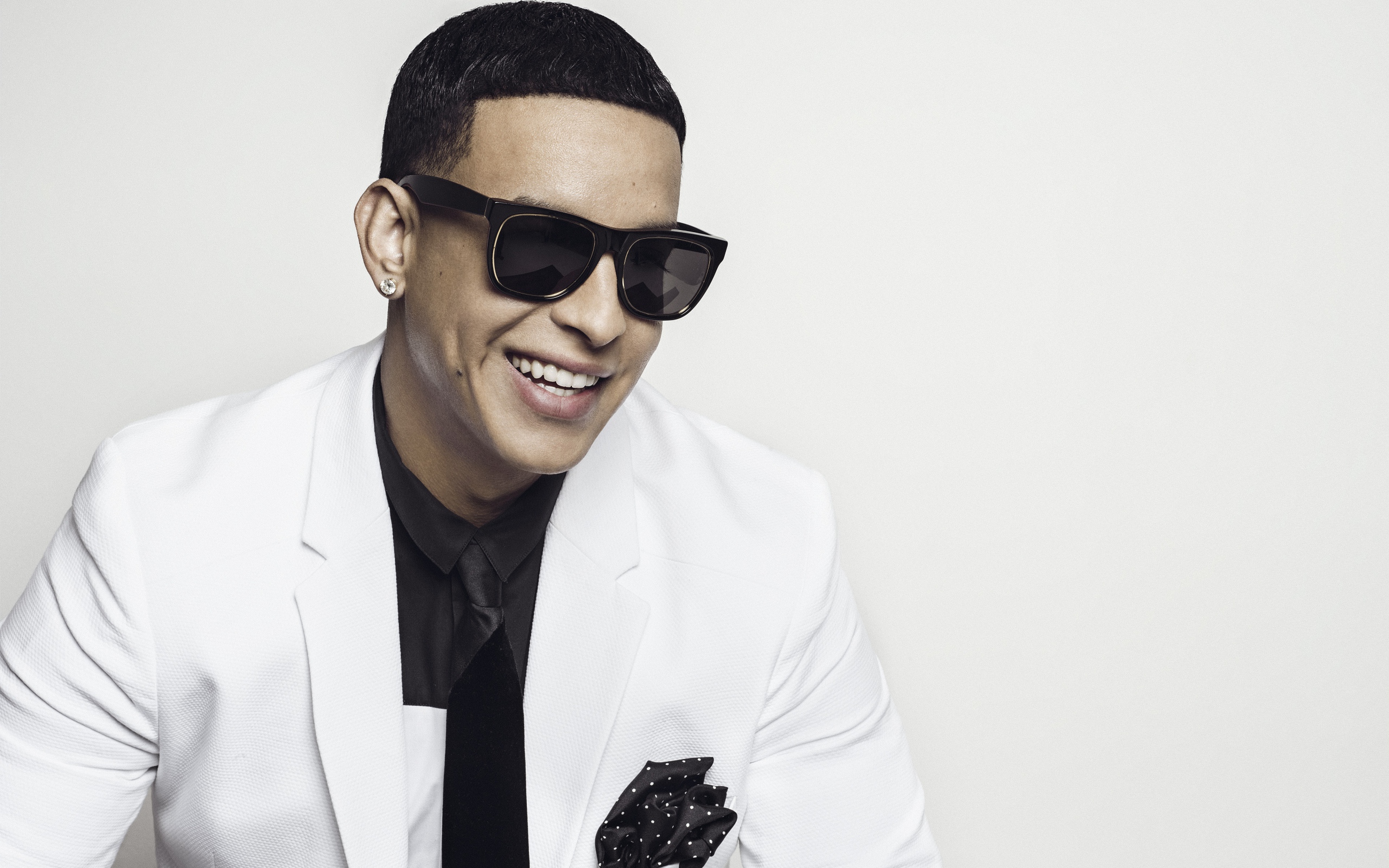 Stylish singer Daddy Yankee wearing black glasses