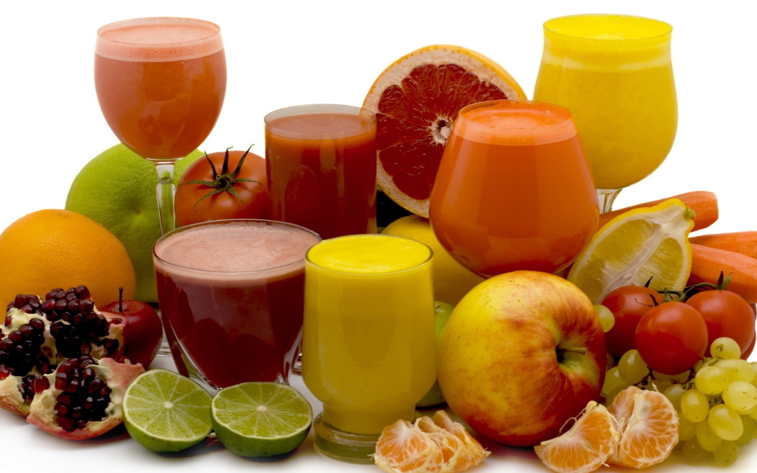 Different fresh juices on a white background with fruits
