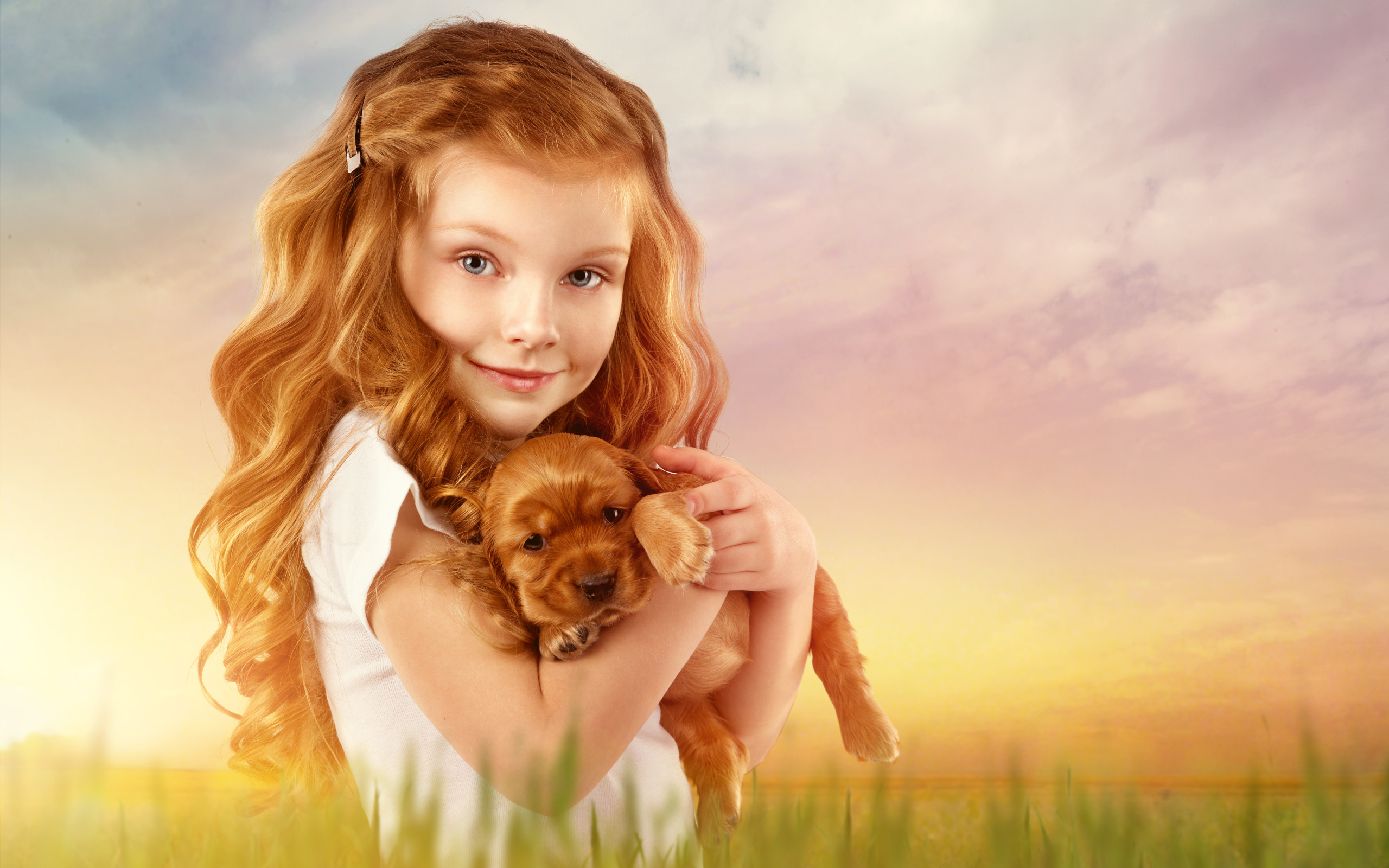 Beautiful red-haired girl with a puppy