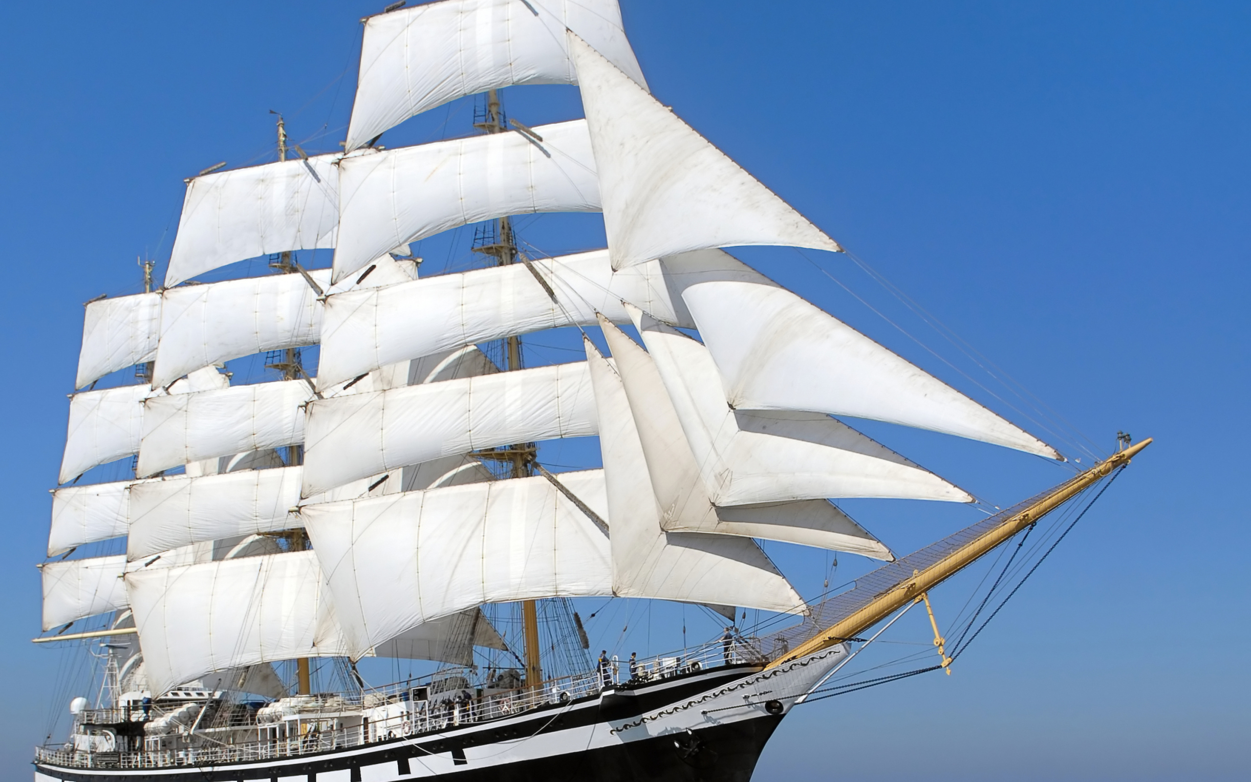 Big ship with white sails in the sea