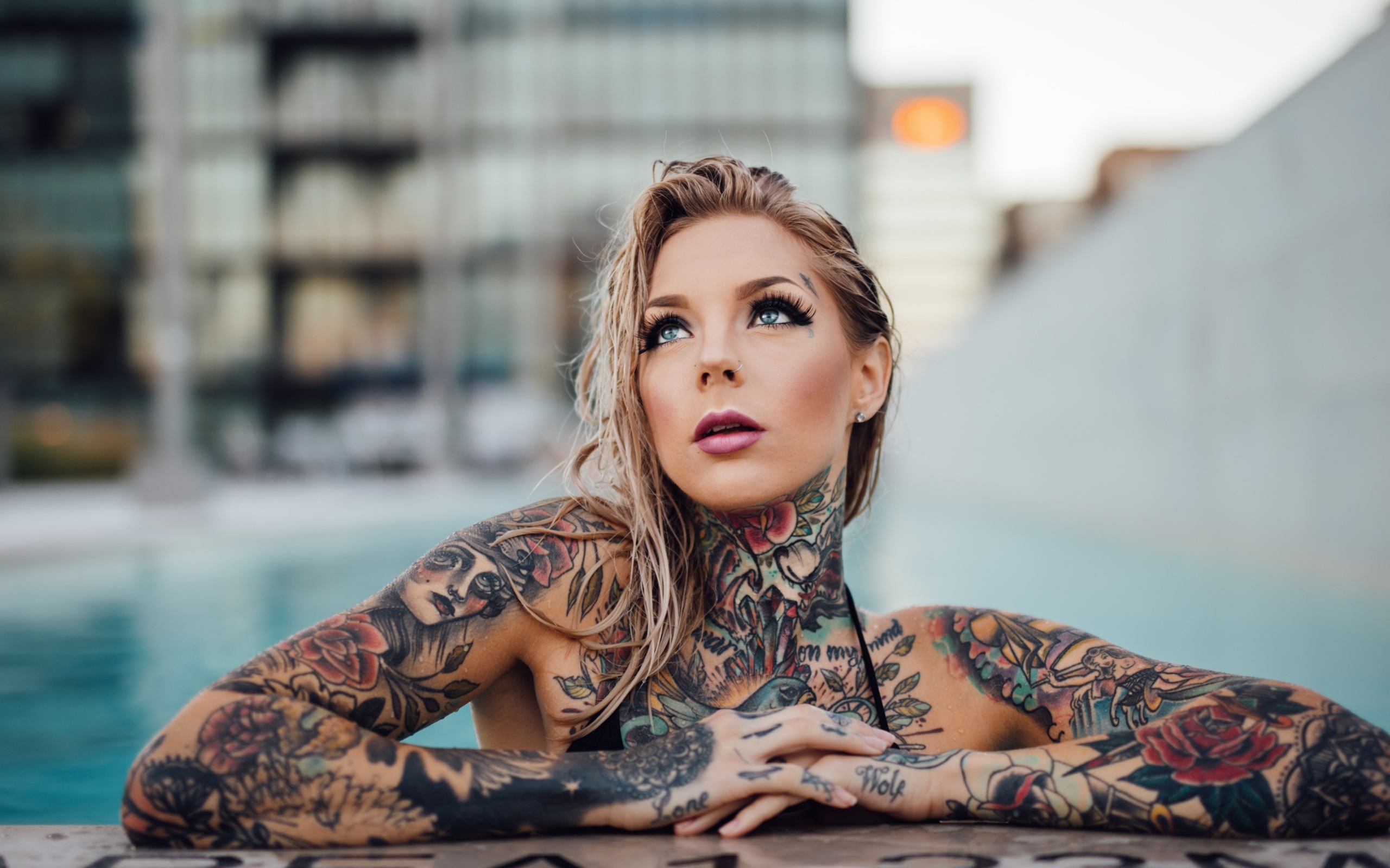 Young girl with beautiful tattoos on her body