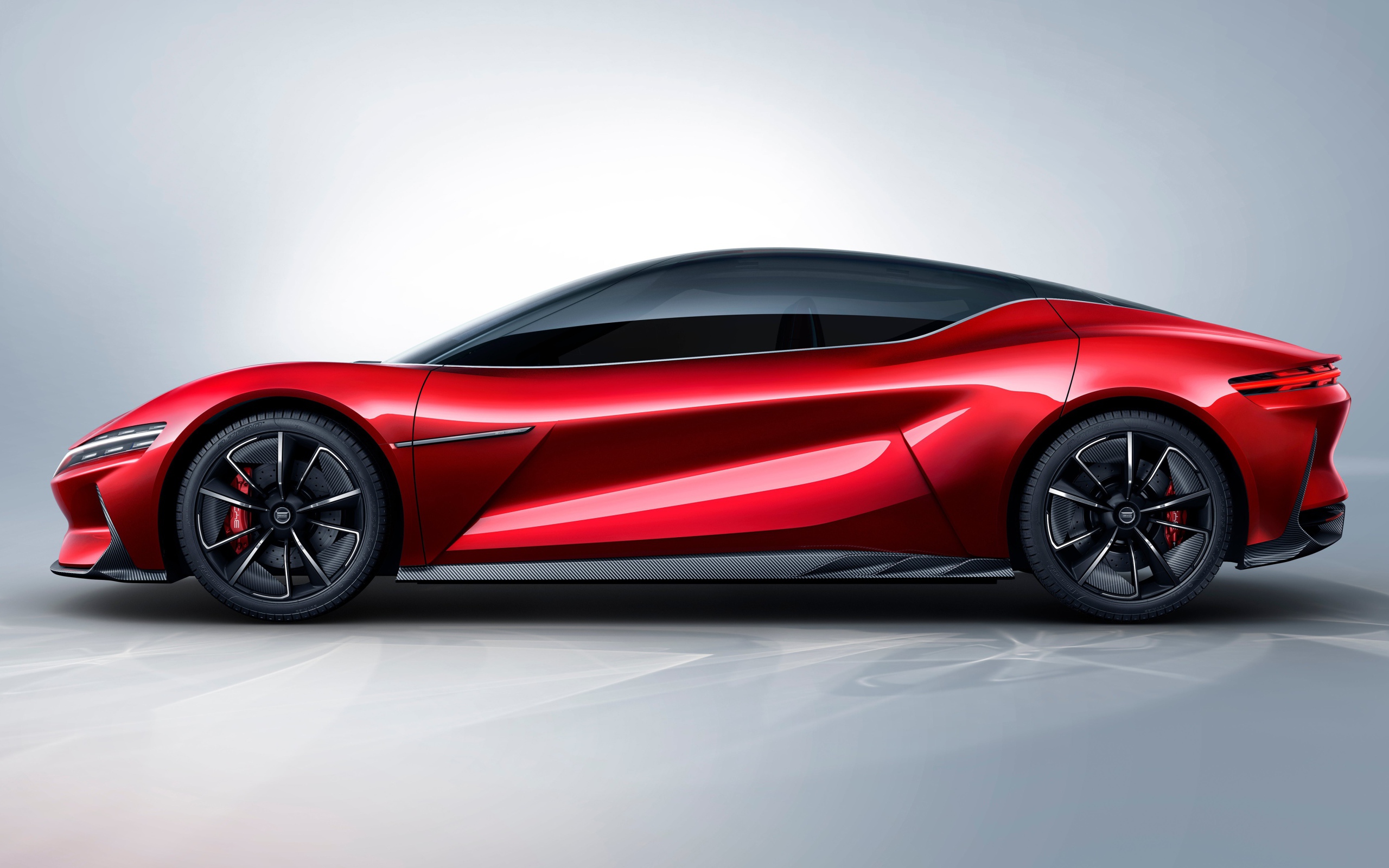 Красный автомобиль BYD E-SEED GT 2019 года на сером фоне