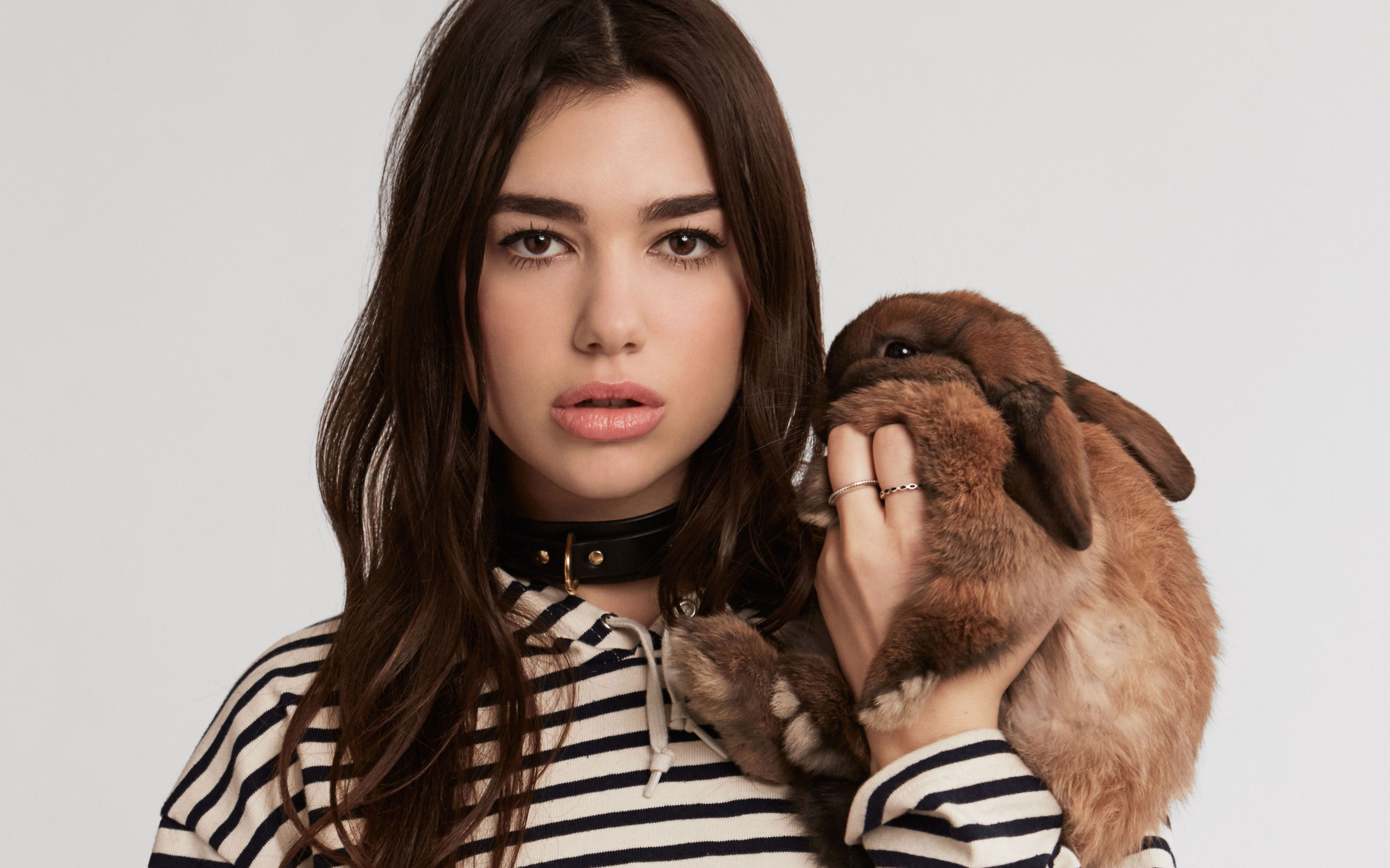 Singer Dua Lipa with a decorative rabbit in her hands