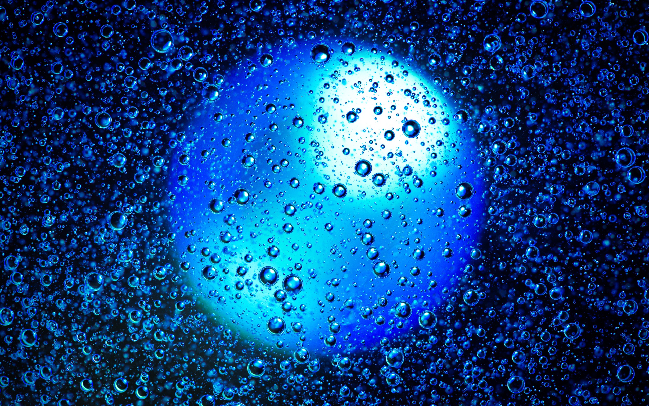 Blue ball in water with bubbles